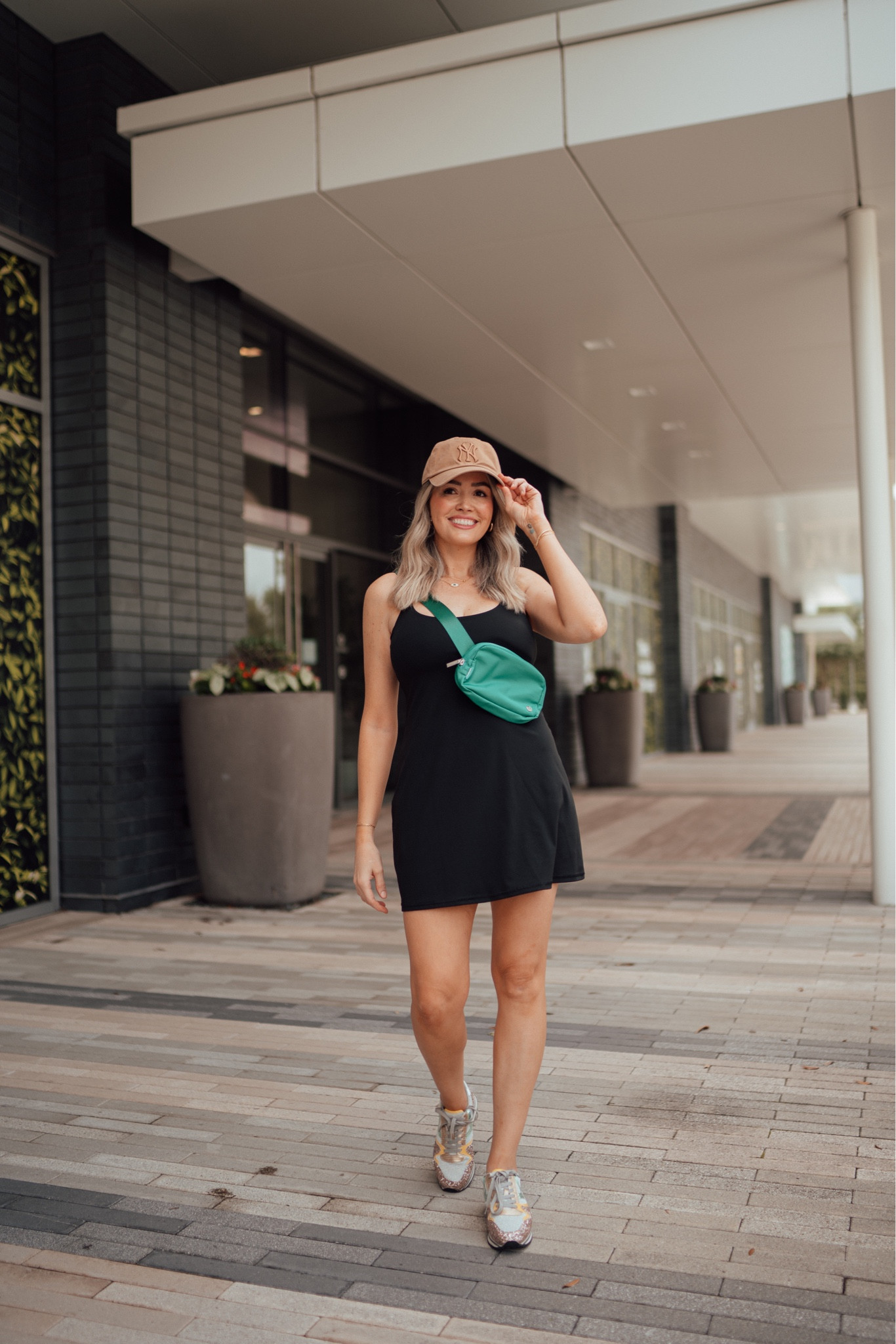 Moms who value style outfit. This tennis dress is so comfortable, has a built in bra and comes with separate shorts! No more completely undressing to use the potty 🙊🚽 add a lululemon everywhere belt bag, some golden sparkle sneakers, Yankees baseball cap or your fav team, diff sunglasses and some sequin nyc jewelry and you have an easy mom on the go look. Everything fits tts - everywhere belt bag - golden goose sneakers - baseball caps - travelers dess - tennis dress  - tennis skirts - mom style - fashion jewelry - tennis bracelet - New york yankees cap - astros cap - dodgers cap -  taylor swift outfit - nashville outfit - spring dress - white dress - country concert - dress - reebok sneakers

#LTKfit #LTKU #LTKFind