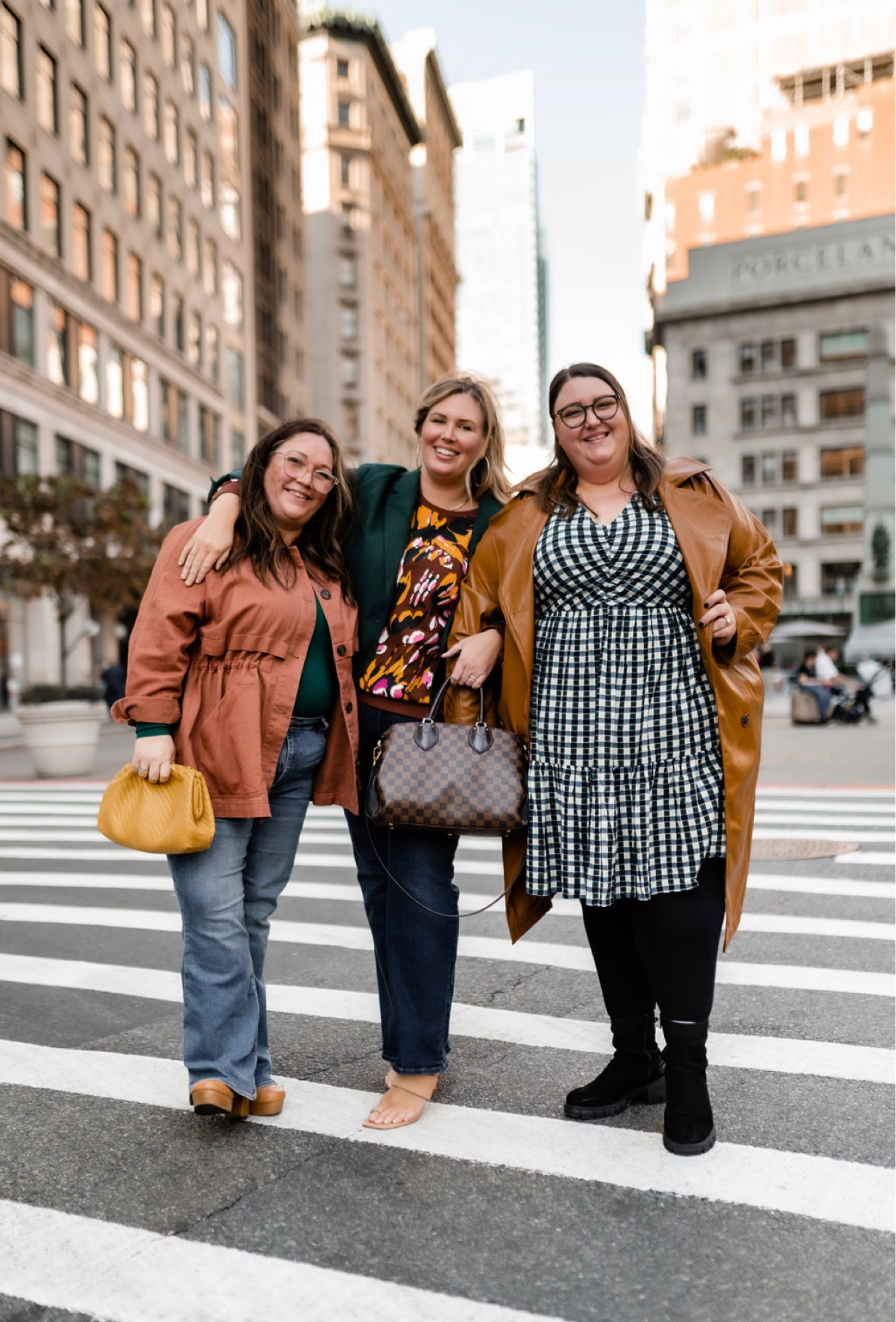 Plus size fall fashion in NYC. Ashley is wearing a 2X sweatshirt from Walmart, Madewell flare jeans in a size 18W and a 2X blazer. Jess is wearing a pair of American Eagle jeans in a size 18S, an Abercrombie bodysuit in a size XL, and a Madewell jacket in a 2X. Caroline is wearing a Target faux leather trench in a 3X, a Target dress in a 4X, and a pair of Torrid leggings in a size 5. 

#LTKstyletip #LTKcurves #LTKSeasonal
