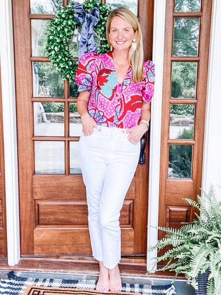 The top from the ranch water reel! It’s a few years old but I found a few for resale. It can be worn backward and forward and perfect with white jeans. ❤️💓❤️ it’s the Rhode Nisha top. 

#LTKstyletip