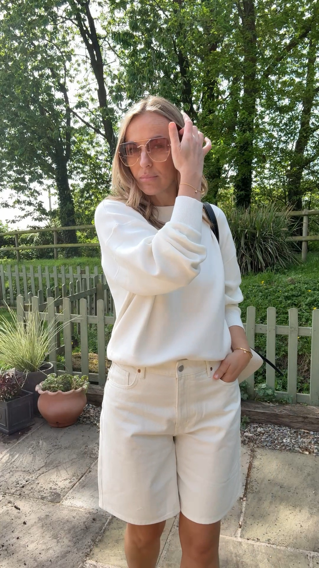 100% cotton essential spring knit 
I love this knitted sweatshirt and reach for it a lot when styling … 
It’s a premium piece at a high street price . 
Wearing in a size large 

The shorts a chic longer line in a comfortable cotton white denim . 
Wearing a U.K. 14 

It’s a simple look - yet chic and practical. 

Spring outfit 
Denim shorts 
Jorts 
White shorts 
Spring knits #LTKspring

#LTKtravel #LTKuk