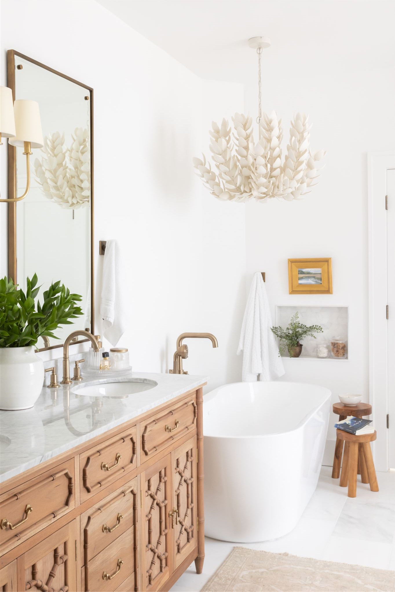 Bathroom inspiration- wood vanity and brass mirrors with natural chandelier.



#LTKhome #LTKsalealert #LTKFind