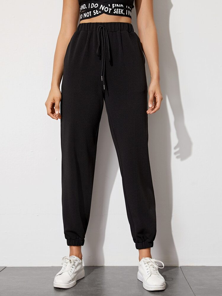 SHEIN Pantalones cónicos unicolor de cintura con cordón | SHEIN