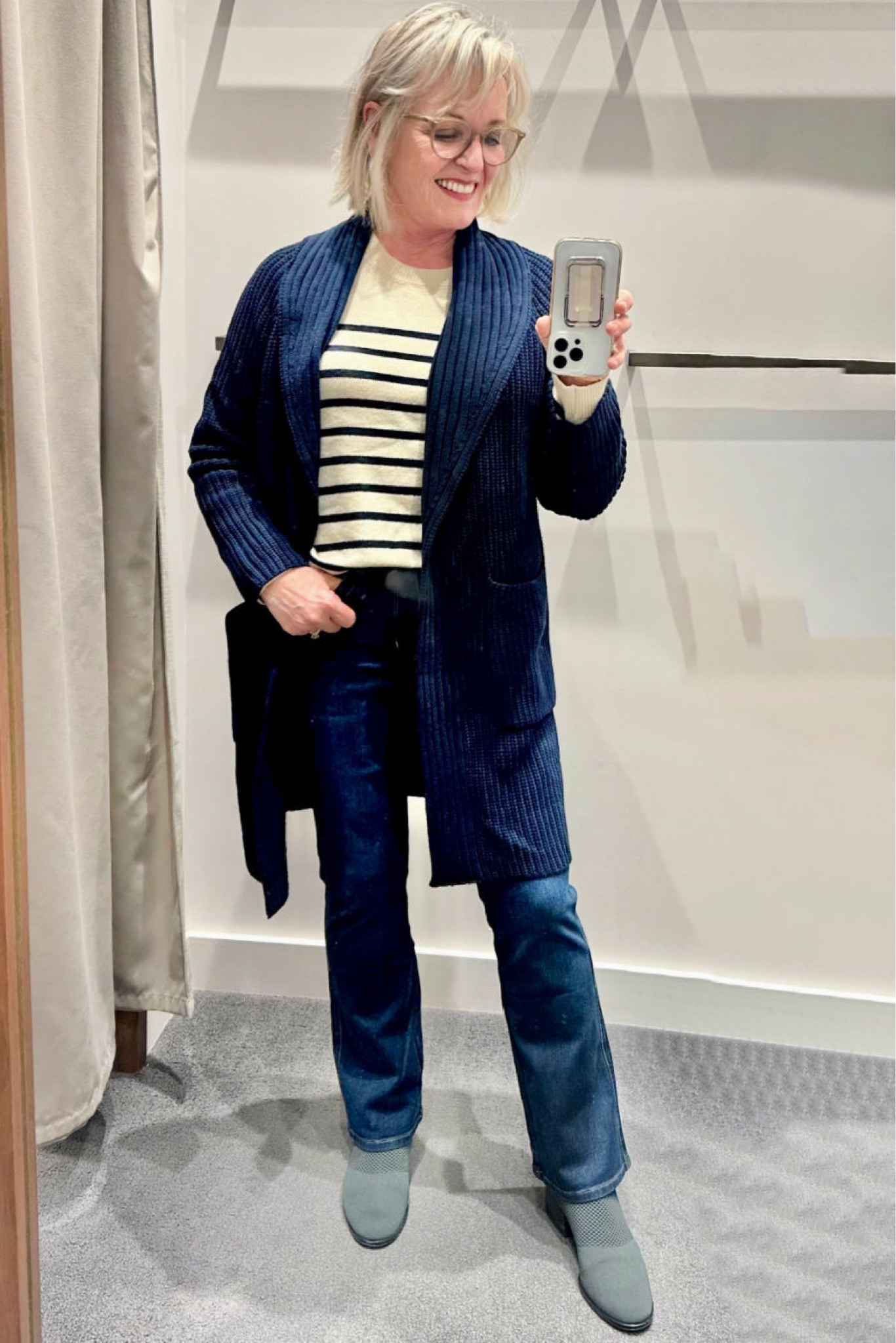 This rib/textured cardigan from J. Jill does not disappoint. It’s a midweight cotton acrylic that feels substantial, but won’t be too hot indoors. It’s a great layering piece in a beautiful shade of navy. I’m wearing it over the button shoulder pullover sweater in a stripe that’s very on-trend and the high-rise boot cut jeans that I love.

#JJill #JJillFashion #Jjillwinterfashion #WinterOutfit #Fashion #Fashionover50 #Fashionover60 