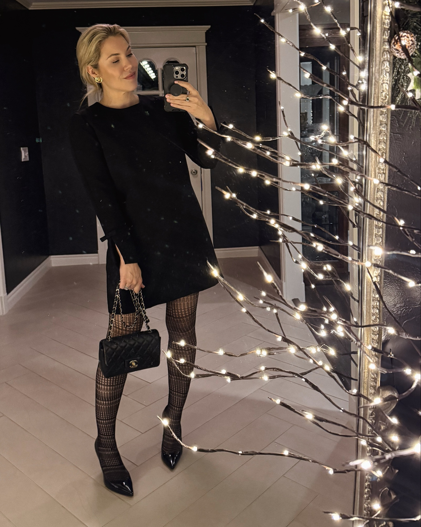 A simple black dress with bows details on back and sleeves 

#LTKHoliday #LTKSaleAlert