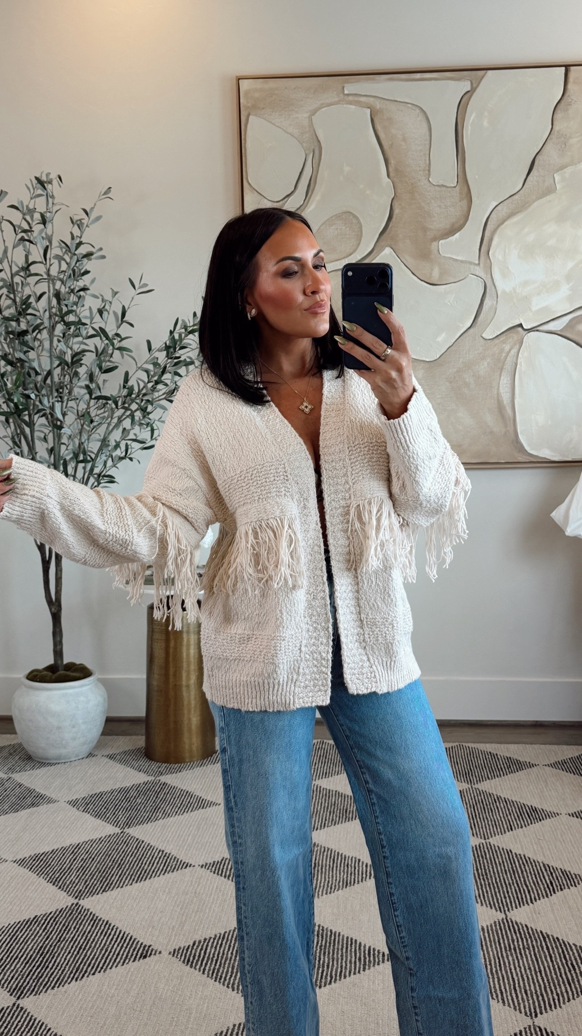 Cute little fringe cardigan! 

In a small