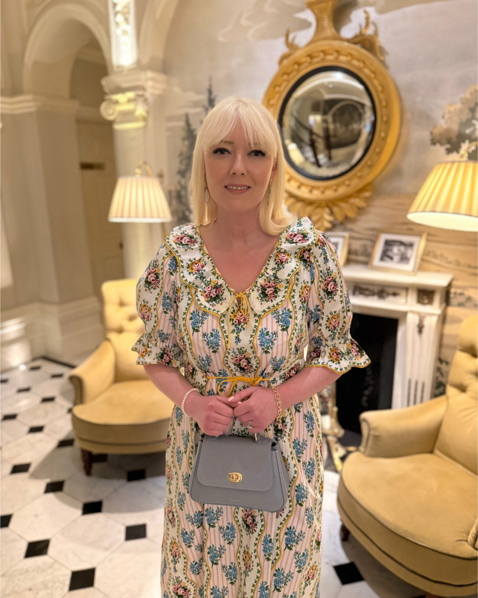 Happy weekend! I have a new midi dress to show you, featuring a pretty floral stripe screen print in pink, blue and yellow with Marie Antoinette-style ruffles - the Vintage Bouquet Ava Dress by Pink City Prints which I partnered with a blue leather top handle bag, gold Mary Janes, a pearl bracelet and pastel statement drop earrings! See product list for more styling ideas 💛🩵🩷

#LTKspring #LTKdresses #LTKeurope