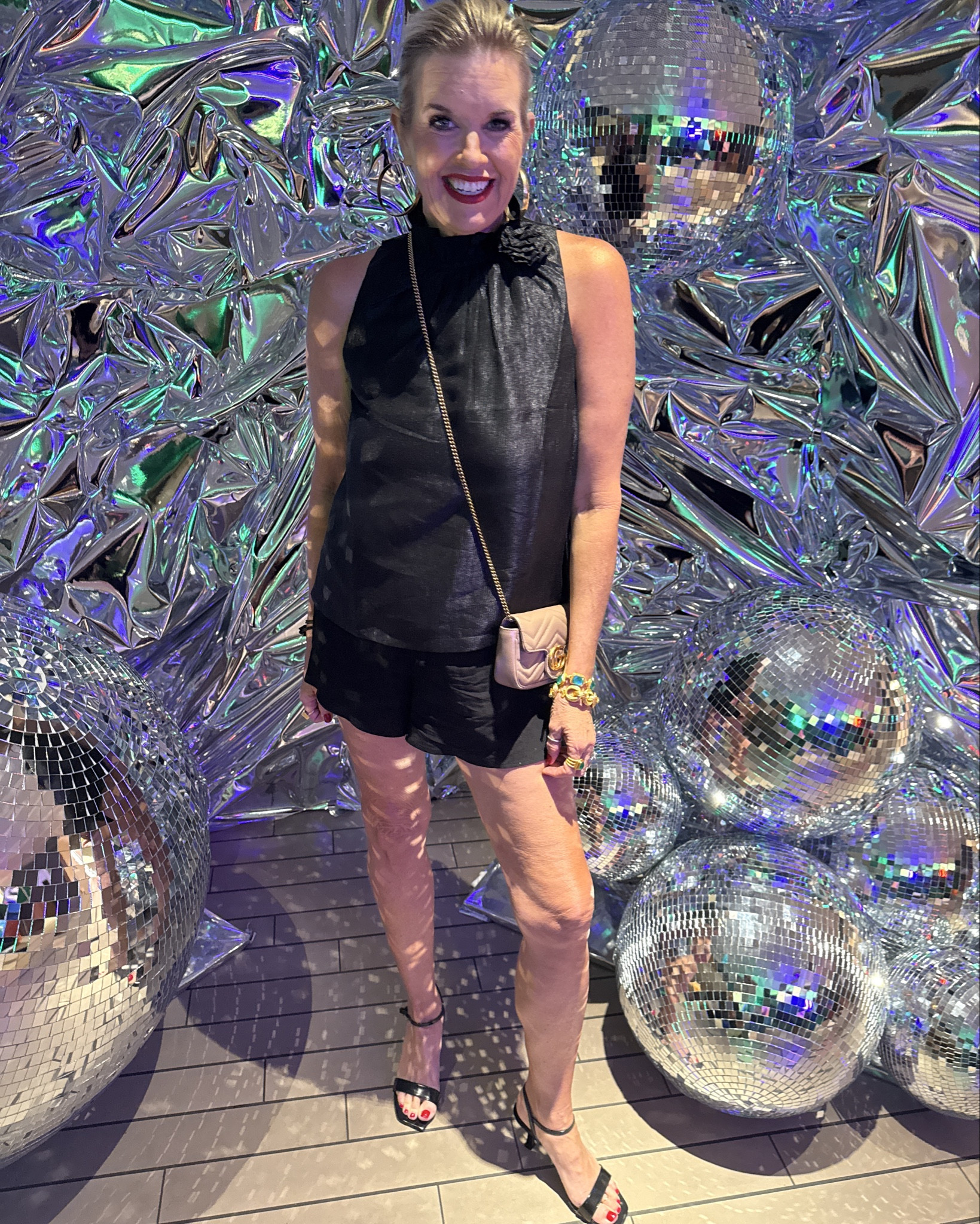 Holiday Outfit idea
Warm weather

Black halter top with bow back and Rossetti pin at neckline
By social threads tts 

Perfect paired with black flower shorts and a strappy kitten heel

Gold chunky hoops 
And Julie Voss bangles and rings 

Gucci mini marmot bag

#LTKParties #LTKHoliday #LTKStyleTip