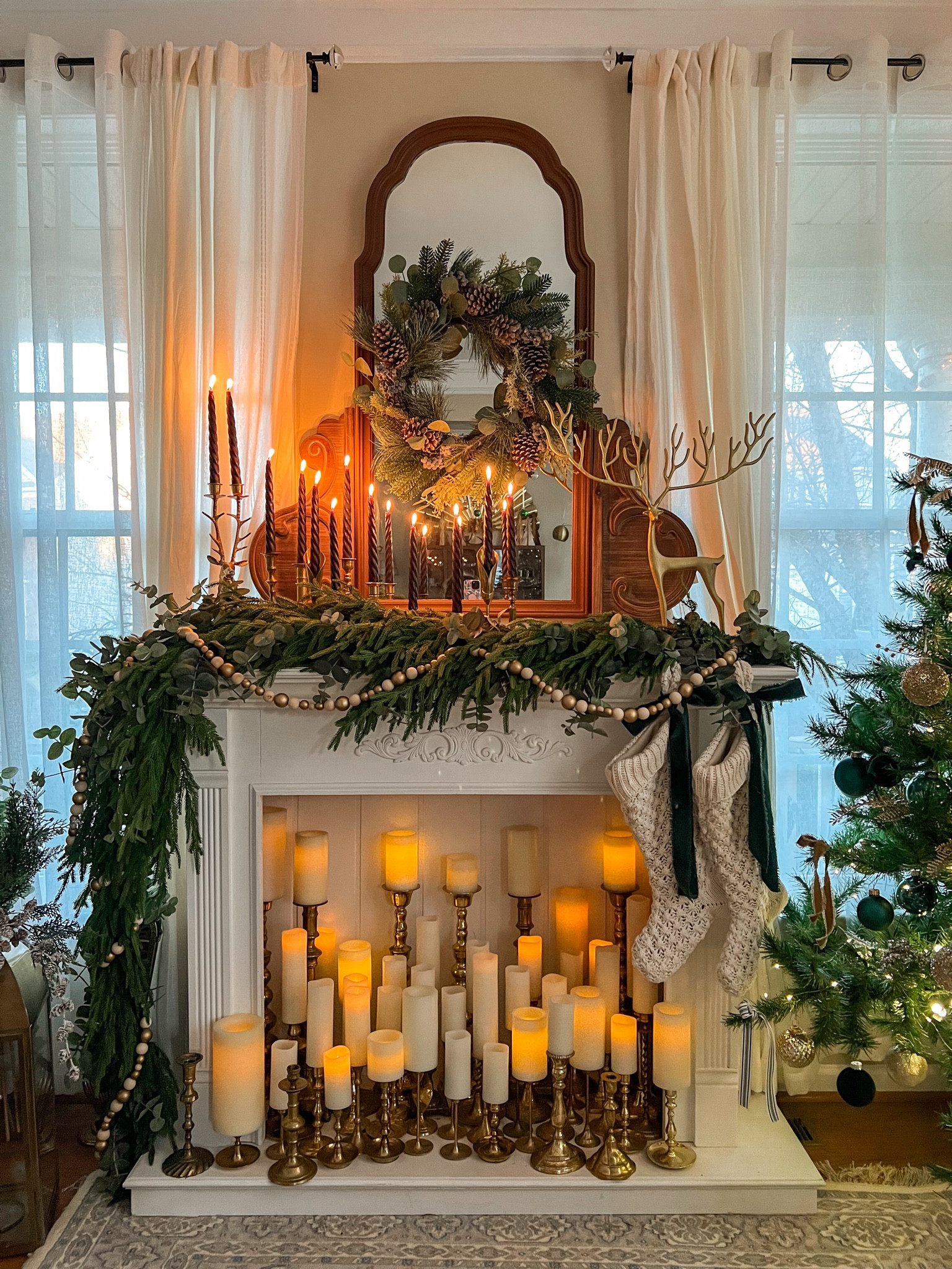 Our cozy Christmas mantle is such a vibe! All of the items shown are from years ago, but I’ve found the closest matches available. The garland is an exact match and is the only garland I ever use! 
#LTKchristmas #christmasmantle #christmasdecor 

#LTKHome #LTKHoliday #LTKSeasonal