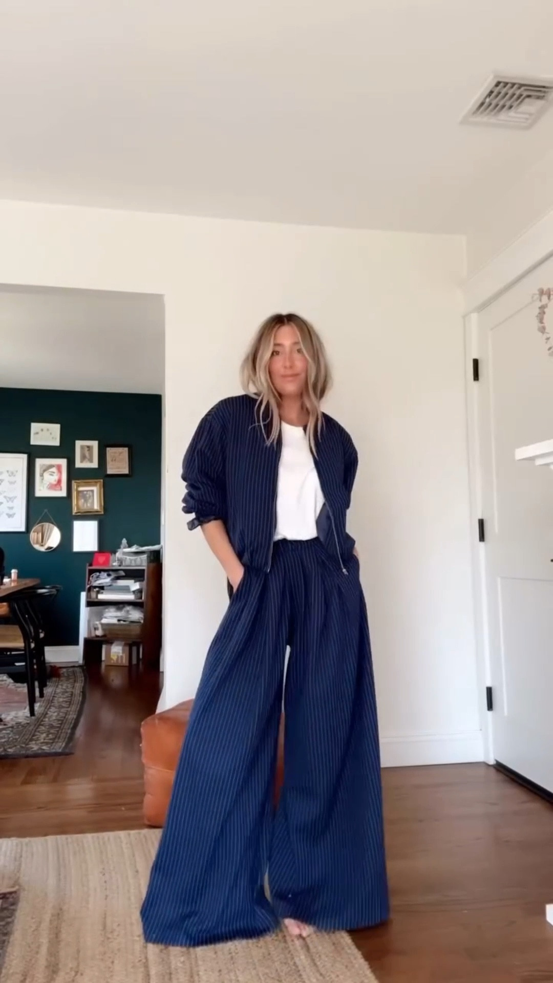 My go-to uniform! Knit pin stripe wide leg trousers, a light bomber jacket and the perfect white teeeee! Everything is @howdoyouwearthat and it’s dropping in just a couple days!!! Sign up for texts on our site to get notified once it drops — in the meantime, comment SHOP and I’ll send you the styling pieces!

I wear a S/M in jacket, small pant and medium in tee!