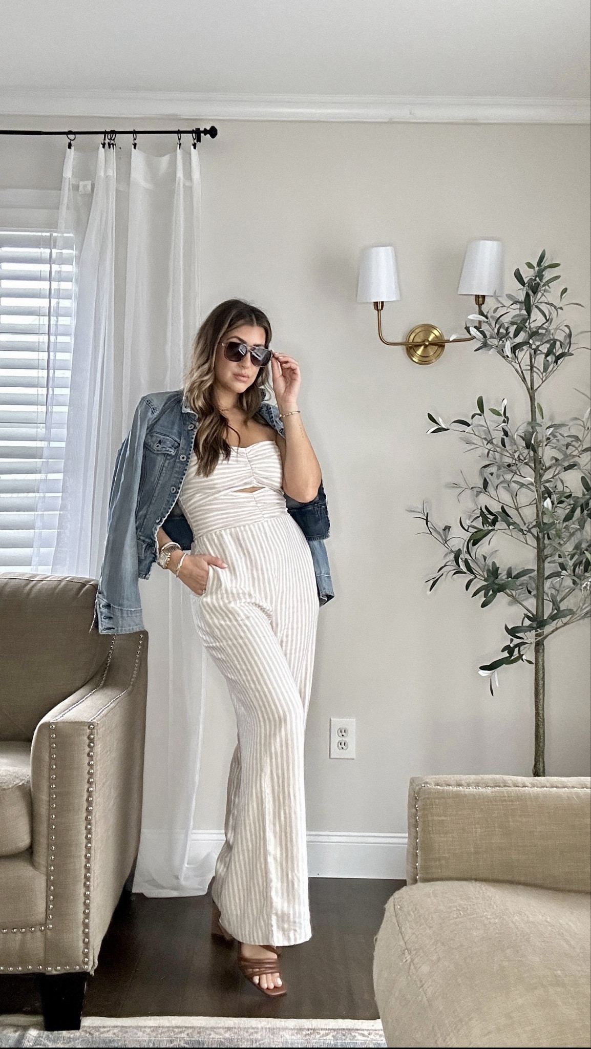 Okayyyyyyy I’m OBsessed. This neutral striped sleeveless jumpsuit with a cut-out is a spring dress alternative and perfect warm weather, spring break vacation outfit and date night outfit material. Now 15% OFF! Paired with strappy heeled sandals and jean jacket. 

Wearing a med and tts in sandals! Use code LAUREN20 for 20% OFF custom jewelry at the sis kiss (link to necklace below!)

Follow @laurenhornstyle for more upcoming warm weather outfits, resort wear and spring fashion. 

#LTKstyletip #LTKfindsunder100 #LTKtravel