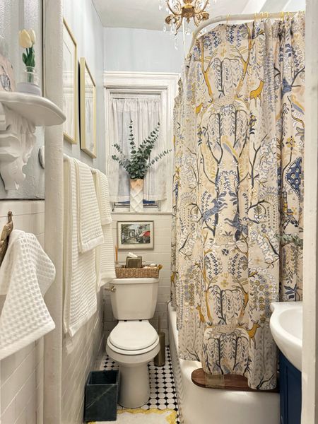 Toilet seat, toilet lever, shower curtain, peacock towel hook, gold tissue box cover, marble trash can, shelf, yellow squiggle bath mat

#LTKhome #LTKstyletip