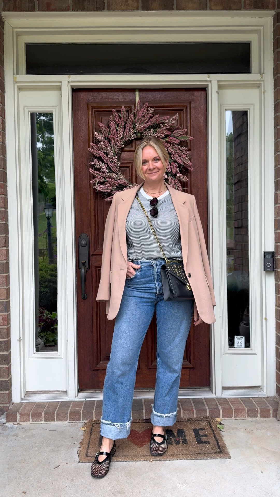 Here are 3 reasons draping your blazer is the easiest styling trick you’re not using enough 👇

✨It adds polish without the structure. Wearing a blazer fully on can sometimes feel stiff or overdressed for a casual day. Draping it over your shoulders gives you all the sophistication of a blazer with none of the formality — same elevated look, zero effort.

✨It instantly defines your silhouette. A draped blazer frames your shoulders and creates shape without adding bulk at the waist. It elongates the whole outfit in a way that just wearing a jacket simply doesn’t.

✨It makes basics look completely intentional. A striped tee and relaxed denim is a great combination on its own. Add a camel blazer draped over the shoulders and suddenly the whole outfit looks styled and considered. One move, completely different result.

OOTD for a day of client appointments ✨ Camel blazer draped + striped tee + relaxed denim with a big cuff + mesh Mary Jane flats + crossbody bag. All from my own closet and most pieces are still shoppable — linked everything below! 👇

#LTKdayinmylife #LTKootd #LTKOver40