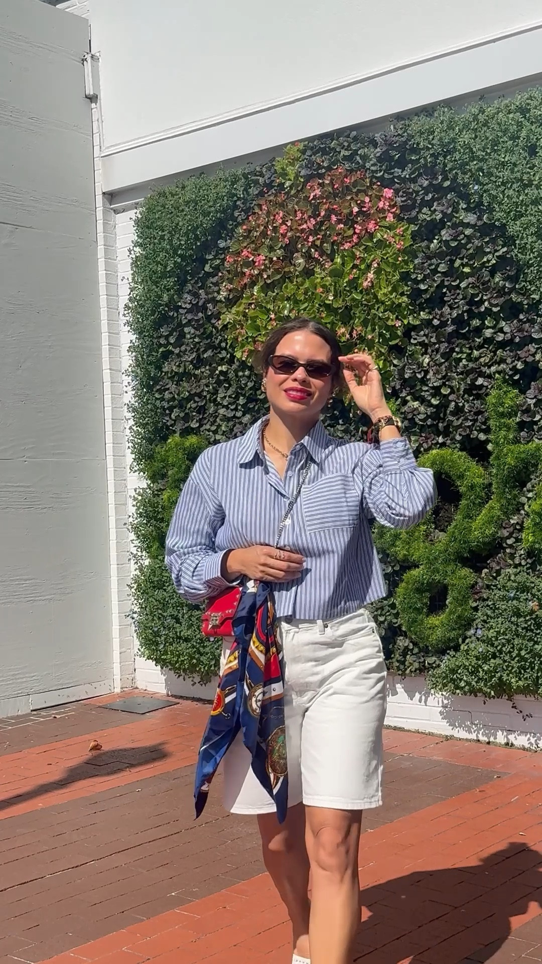 White Bermuda shorts + crisp button-up + scarf 

#LTKOver40 #LTKStyleTip