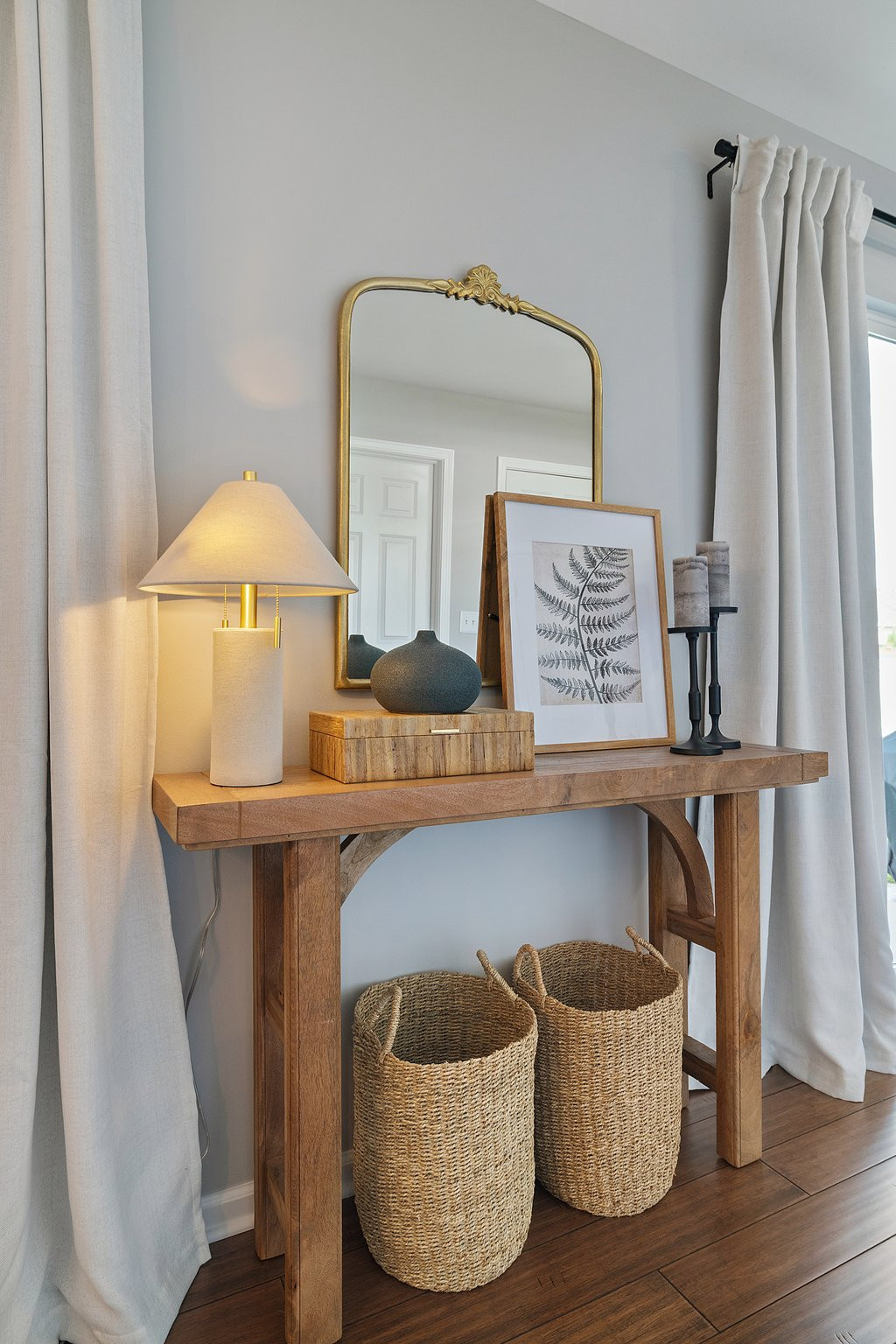  A styled side table is a great way to add interest to an otherwise blank space.  

Adding layers of interest, a mirror for height, and baskets for a practical storage solution. 



 

#LTKSpringSale #LTKHome