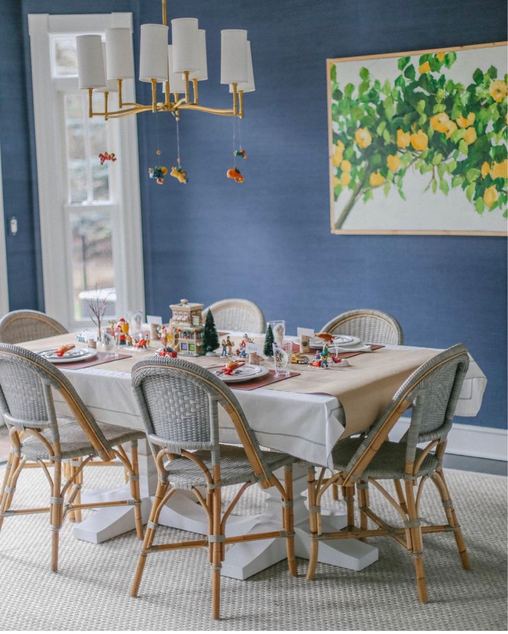 Our kids Christmas table from years past. Craft paper is dual purpose. Saves your tablecloth from spills and the kids can doodle. Including vintage Department 56 figurines and hanging german angels to add an air of whimsy. 

#LTKSeasonal #LTKHoliday #LTKHolidaySale