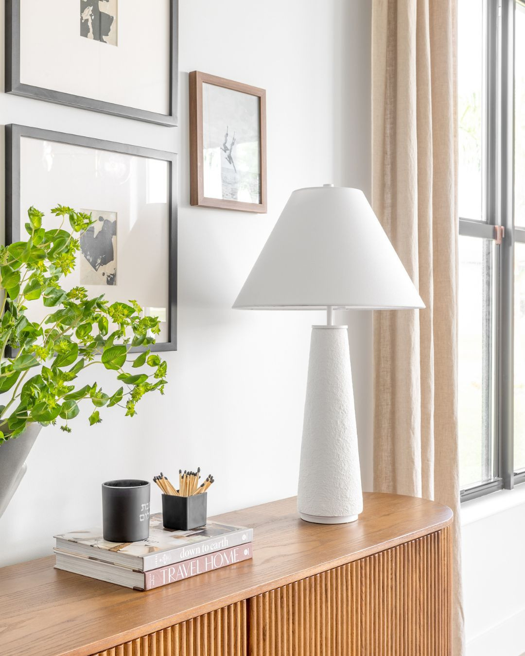 Light, texture, and timeless layers 🤍
This styled console moment brings together clean lines, natural warmth, and soft contrast proving that minimal can still feel rich. We paired a sculptural white lamp with textured wood tones, matte black accents, and a touch of greenery for balance. Shop the look. Perfect for: entryways, living rooms, or anywhere that needs a cozy, elevated touch. 

 #LTKSeasonal #LTKHome