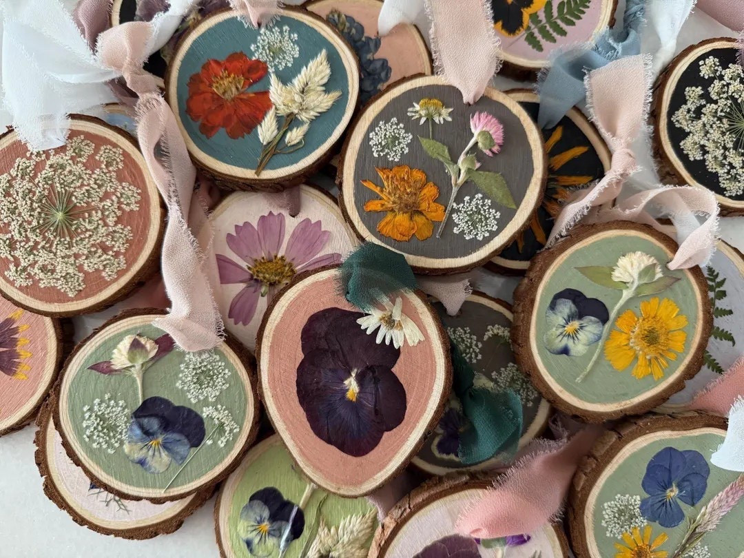 Celebrate nature’s beauty with these handcrafted pressed flower ornaments by littlemeadowflowers. Each piece features blooms grown organically in their garden, preserved and arranged on painted wood disks that highlight every petal and stem. With a mix of beloved varieties—like pansy, chamomile, cosmos, nigella, and more—each ornament becomes a one-of-a-kind keepsake finished with a soft chiffon or organza ribbon. Perfect for thoughtful gifting or adding botanical charm to your holiday décor. #EtsyFinds #PressedFlowers #BotanicalDecor #HolidayOrnaments #FlowerLovers #LTKHoliday #NatureInspiredDecor

#LTKHome #LTKHoliday #LTKGiftGuide