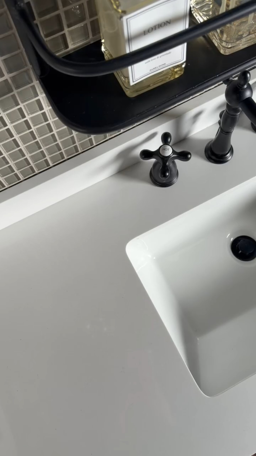 Timeless bathroom vanity details that elevate the everyday 🖤
This matte black widespread bathroom faucet paired with a rectangular undermount sink, white quartz countertop, ceramic sink basin, and cross-handle faucet hardware creates a clean, classic look. Finished with a neutral mosaic tile backsplash and modern bathroom accessories, this setup proves that great design lives in the details.

#eanesinteriors #bathroomvanity #bathroomfaucet #matteblackfaucet #widespreadfaucet #undermountsink #quartzcountertop #bathroomhardware #classicbathroom #modernbathroom #bathroomdesign #interiordetails #ltkhome

#LTKmorningroutine #LTKHome #LTKSeasonal
