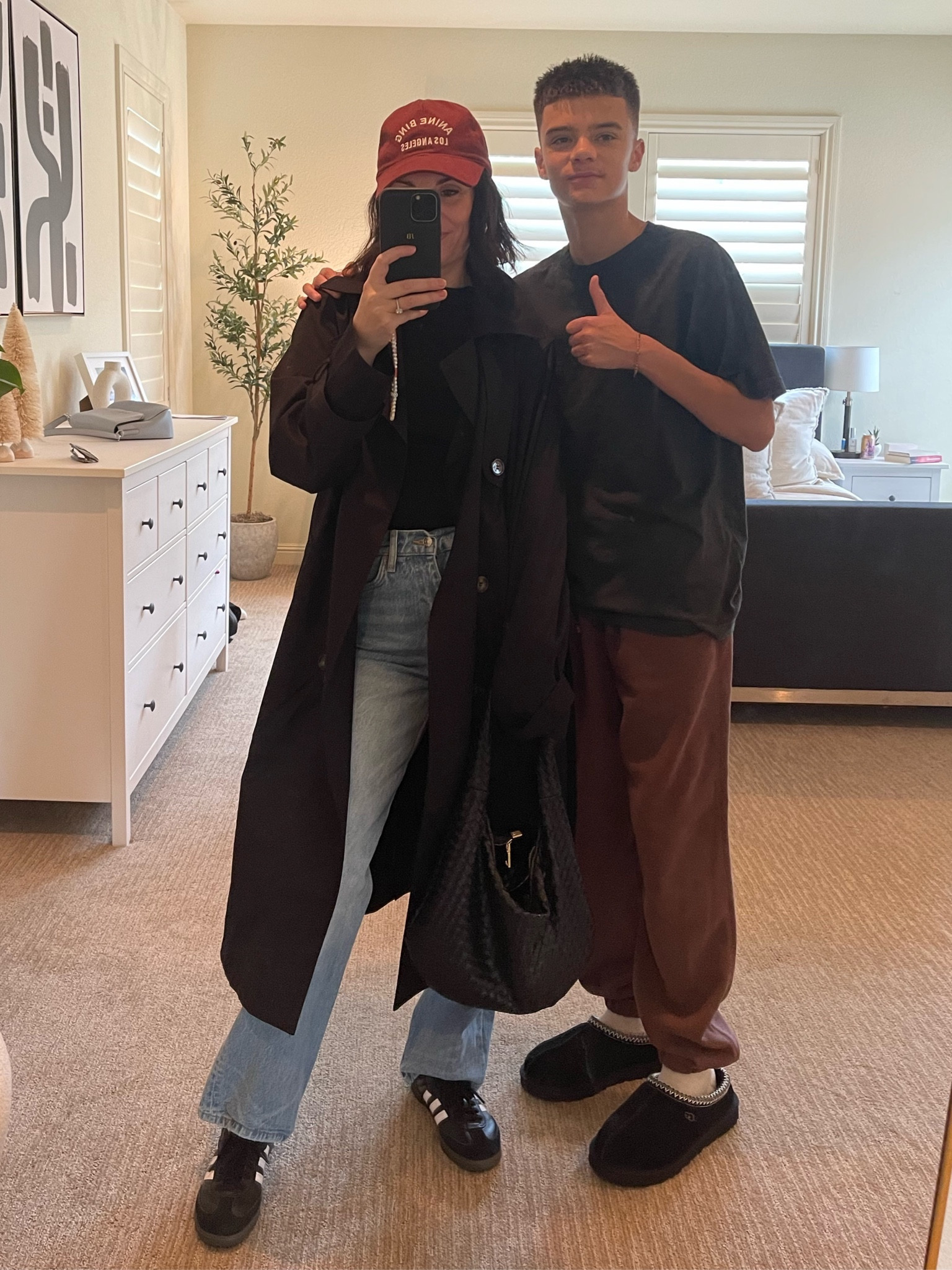 Mom and son fit check ❤️
Black trench coat (wardrobe essential black or beige) jeans black sambas , aninebing cap, Anthropology bag , 
Son wearing cotton on sweats, black Tasman Uggs oversized tee. 
#falloutfit #family 

#LTKSeasonal #LTKshoecrush #LTKfamily