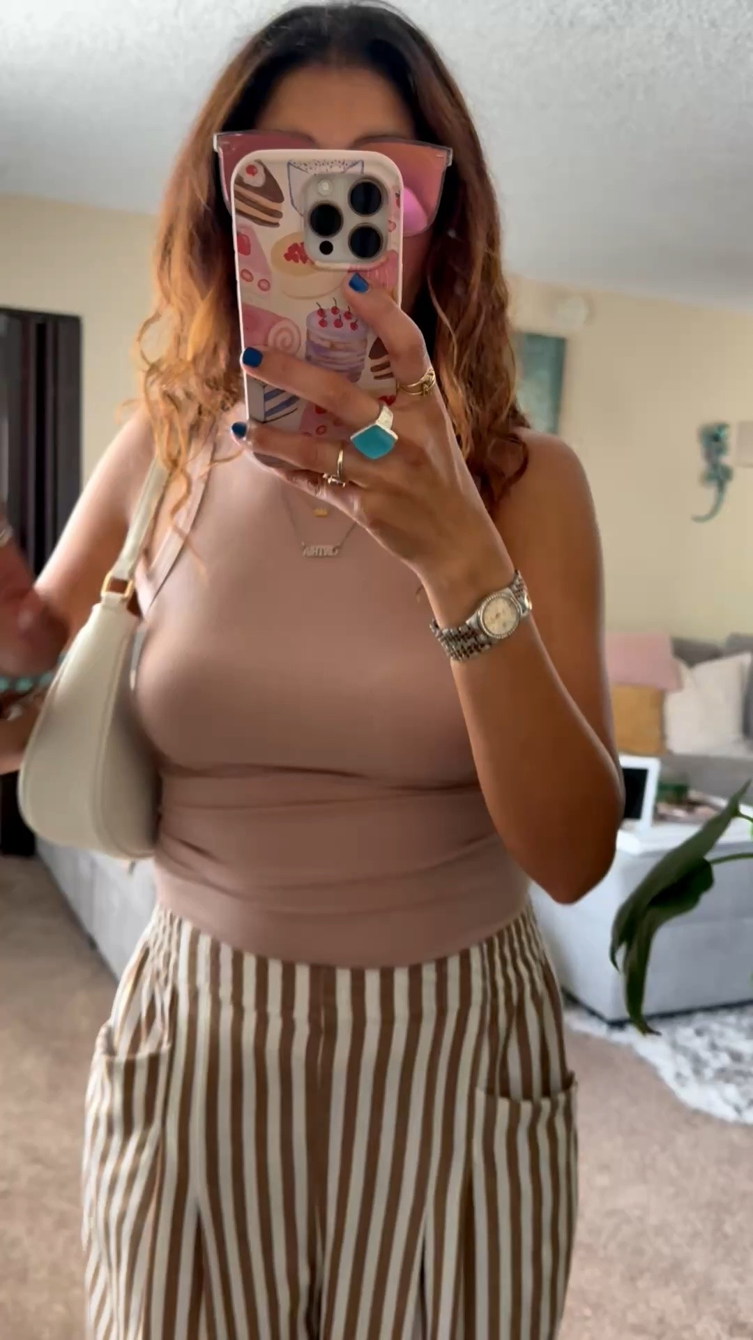 Neutral outfit perfection 🤍 These striped palazzo pants are lightweight, flattering, and so easy to style for spring & summer. Paired them with a fitted ribbed tank, mini shoulder bag, and oversized sunnies for an effortless chic everyday look. Perfect for brunch, vacation, errands, or a casual date night outfit. #LTKStyle #OOTD

striped palazzo pants, wide leg pants outfit, neutral outfit, beige tank top outfit, spring fashion, summer outfit inspiration, chic casual outfit, effortless style, vacation outfit, resort wear, everyday fashion, womens style over 40, classy casual outfit, comfy chic look, ribbed tank top, striped trousers, minimalist fashion, neutral aesthetic, brunch outfit, coastal chic style

#LTKWorkwear #LTKSeasonal #LTKootd