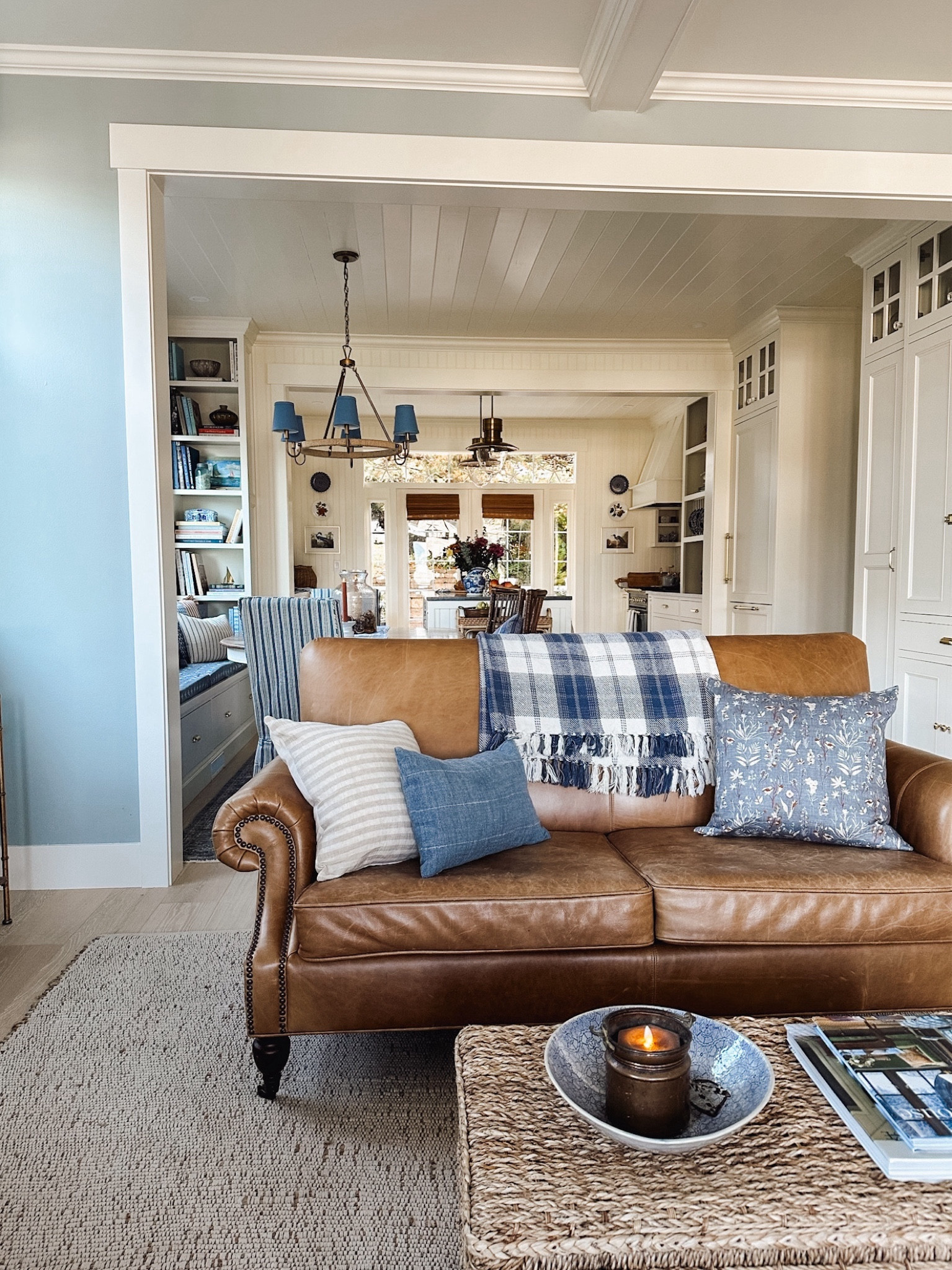 Leather sofa, plaid throw blanket, wicker trunk, battery candle, jute wrapped brass chandelier with shades (color options), striped pillow, floral pillow. See more on theinspiredroom.net

#LTKsalealert #LTKSeasonal #LTKhome