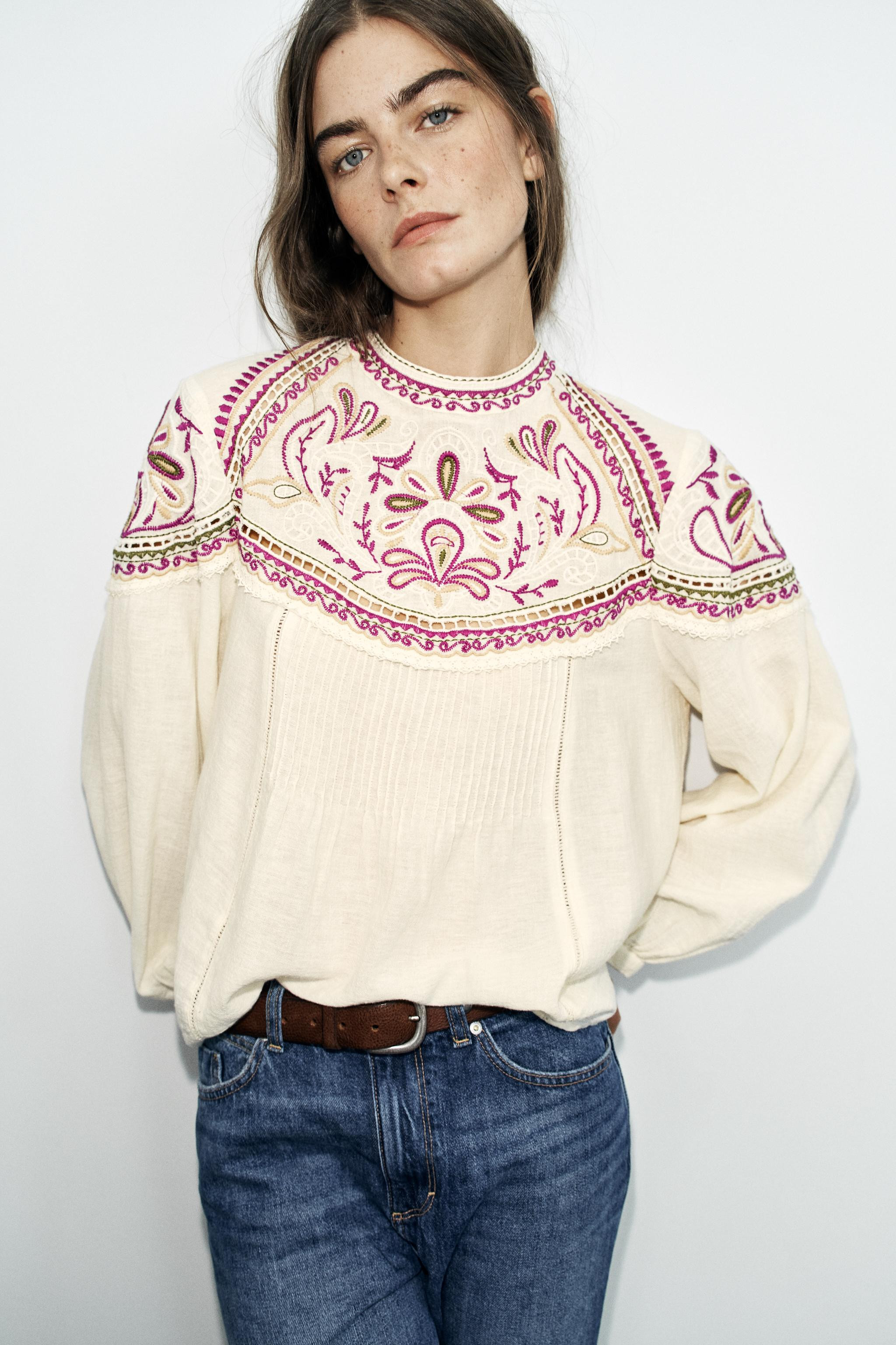 Round neck, long-sleeve blouse. Features contrasting embroidery detailing, tucks, and matching la... | Zara US