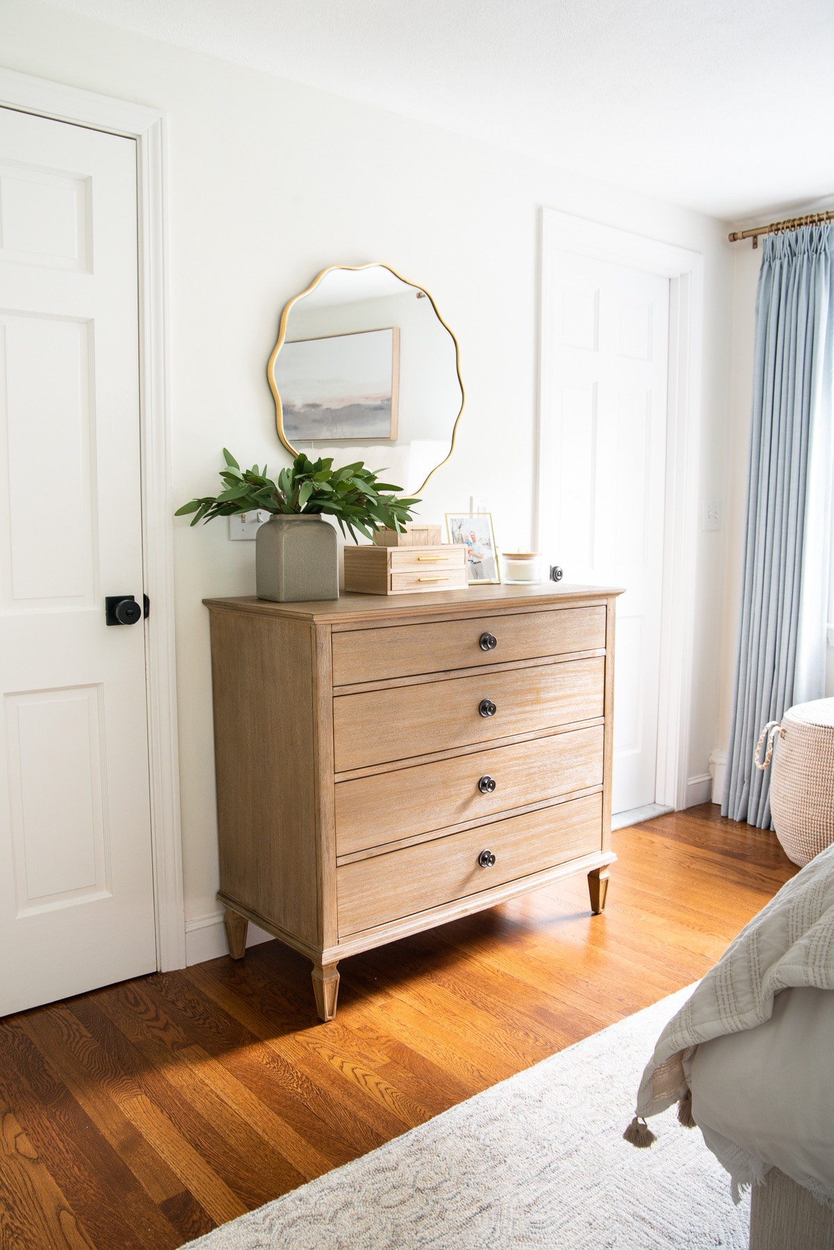 Modern coastal bedroom views✨ This scalloped mirror is the perfect touch!

#LTKHome