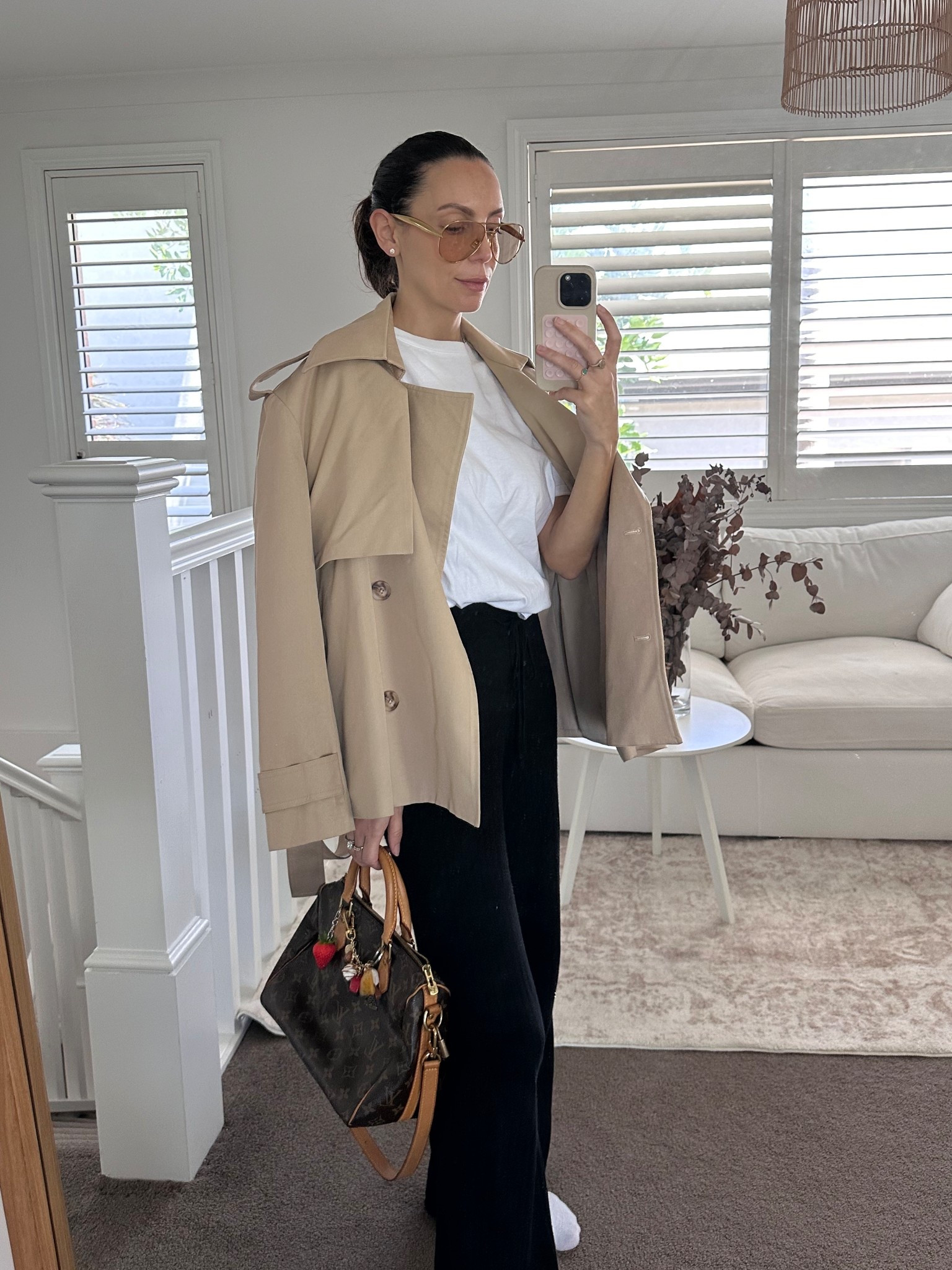 Easy outfit for a day with my son, wearing black pants, white tshirt and crop trench. 

#LTKaustralia #LTKspring