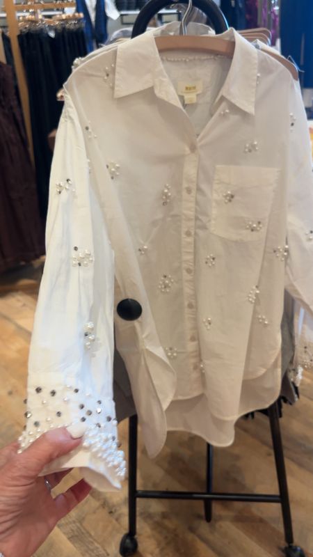 Embellished white button front shirt @anthropologie Dial up or down with denim. Black suiting for an after five look. 
#whiteshirt #whiteblouse #buttonfronttop #rhinestonesandpearls #over50style 

#LTKworkwear #LTKstyletip #LTKover40