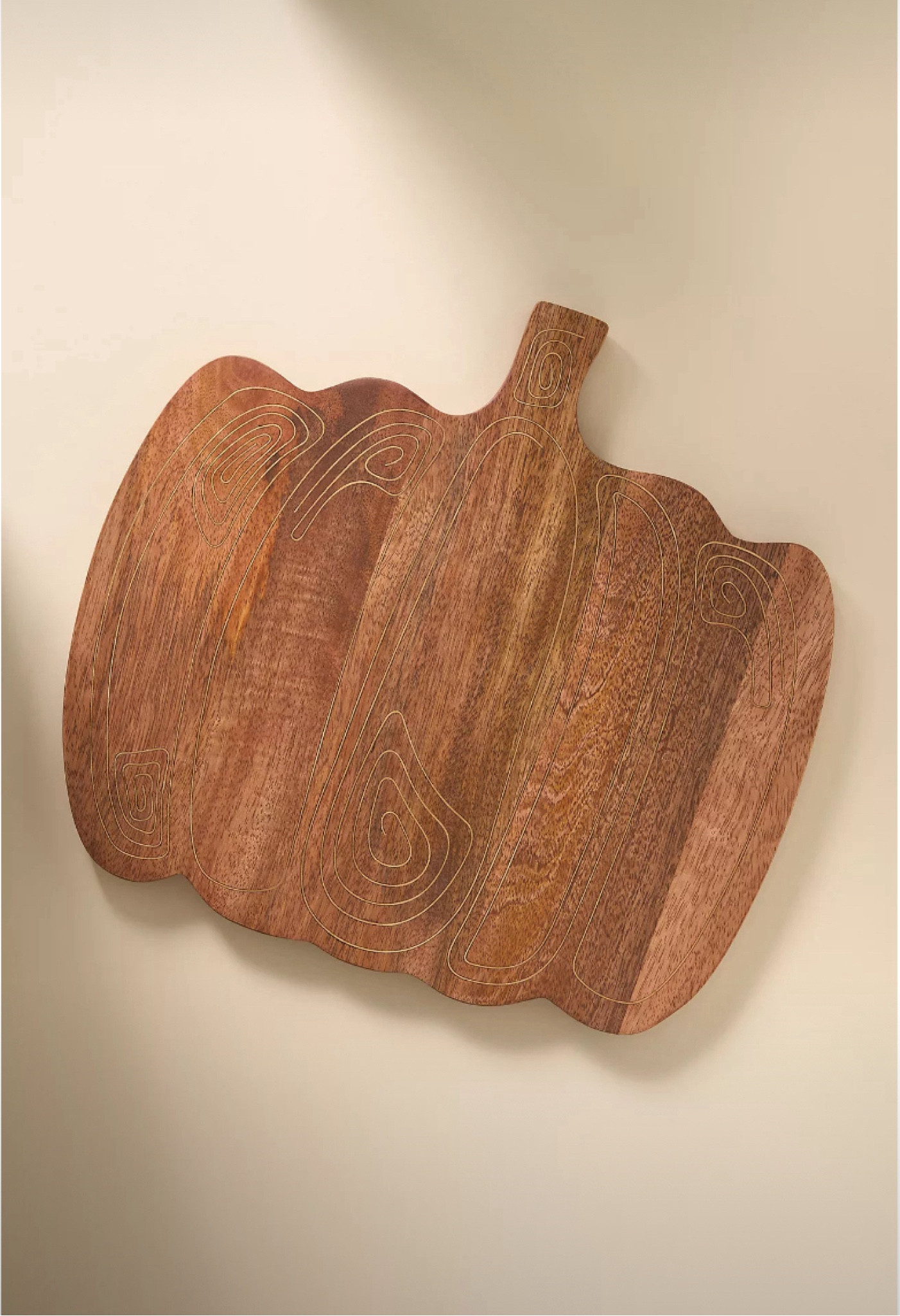 Pumpkin shaped cutting board from anthropologies Halloween collection 

#LTKHome #LTKSeasonal