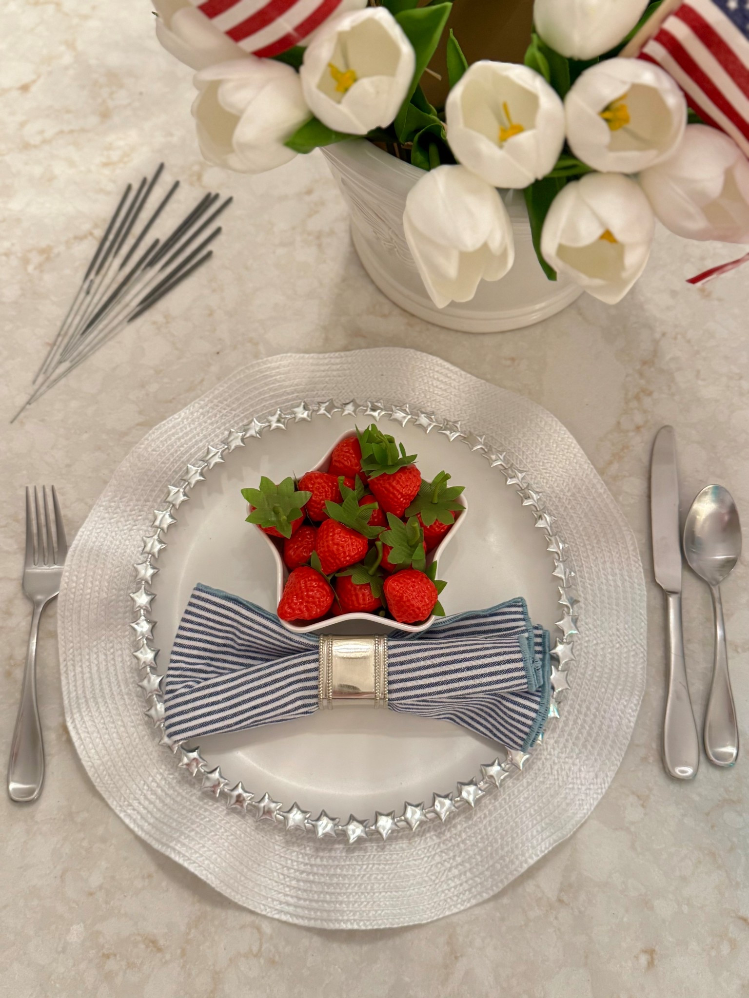 Sweet, simple, and star-spangled! 🍓✨ I wrapped a stripe napkin with a silver cuff and added a star-trimmed charger to give this 4th of July place setting a touch of charm and sparkle. The strawberries pop perfectly for a fresh patriotic touch! 🇺🇸💫

#4thofJulyDecor #StarSpangledStyle #RedWhiteAndBlue #TableSettingGoals #HolidayTablescape #SimpleElegance #DIYDecor #Instagood #Love #JustJennsDesign #Foodie #EntertainingIdeas #PatrioticVibes #SummerTablescape #PartyInStyle #AllAmericanDecor #FestiveTable #FourthOfJulyVibes #CreativeTableDecor #AmericanaStyle

#LTKParties #LTKStyleTip #LTKHome