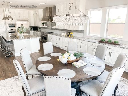 Kitchen, dining room, round ModernFarmhouseGlam Dining Table, dining room chairs, neutral area rug, crystal chandelier, kitchen pendant lighting, Pottery Barn, Wayfair. Farmhouse table. 

#LTKhome