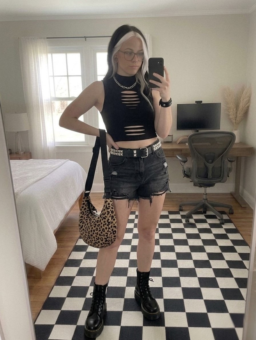 Obsessed with this edgy combo! We are trading the leopard overalls for a distressed "cool girl" vibe. This fitted, slashed crop top is the perfect mix of grit and structure, especially when paired with washed charcoal denim shorts.

The star of the show? These chunky platform combat boots are an absolute staple for any wardrobe. I have tied it all together with a studded vegan leather belt and a leopard hobo bag for that pop of print. Shop the full look, including the exact Dr. Martens and accessories, by clicking the link in my bio!

#LTKootd #LTKSeasonal #LTKMidsize