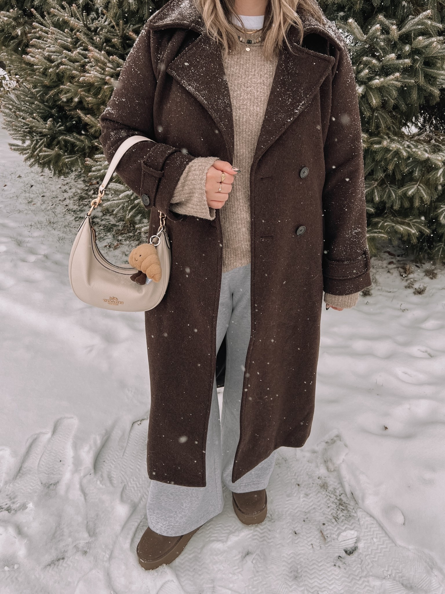 Cozy winter outfit! Wearing my usual size L in the chocolate brown wool trench coat - it’s so warm and such a good staple piece! Also wearing L in the wide leg sweatpants, these are thick and cozy and cute enough to wear out! This white tee is my fave for layering since the neck is higher, wearing my usual size L. My Ugg style boots are Amazon and such good quality! I’m usually a 9.5-10 and wear a 10 in these. Linked similar neutral sweaters & cream beanie

#LTKstyletip #LTKwinter #LTKmidsize