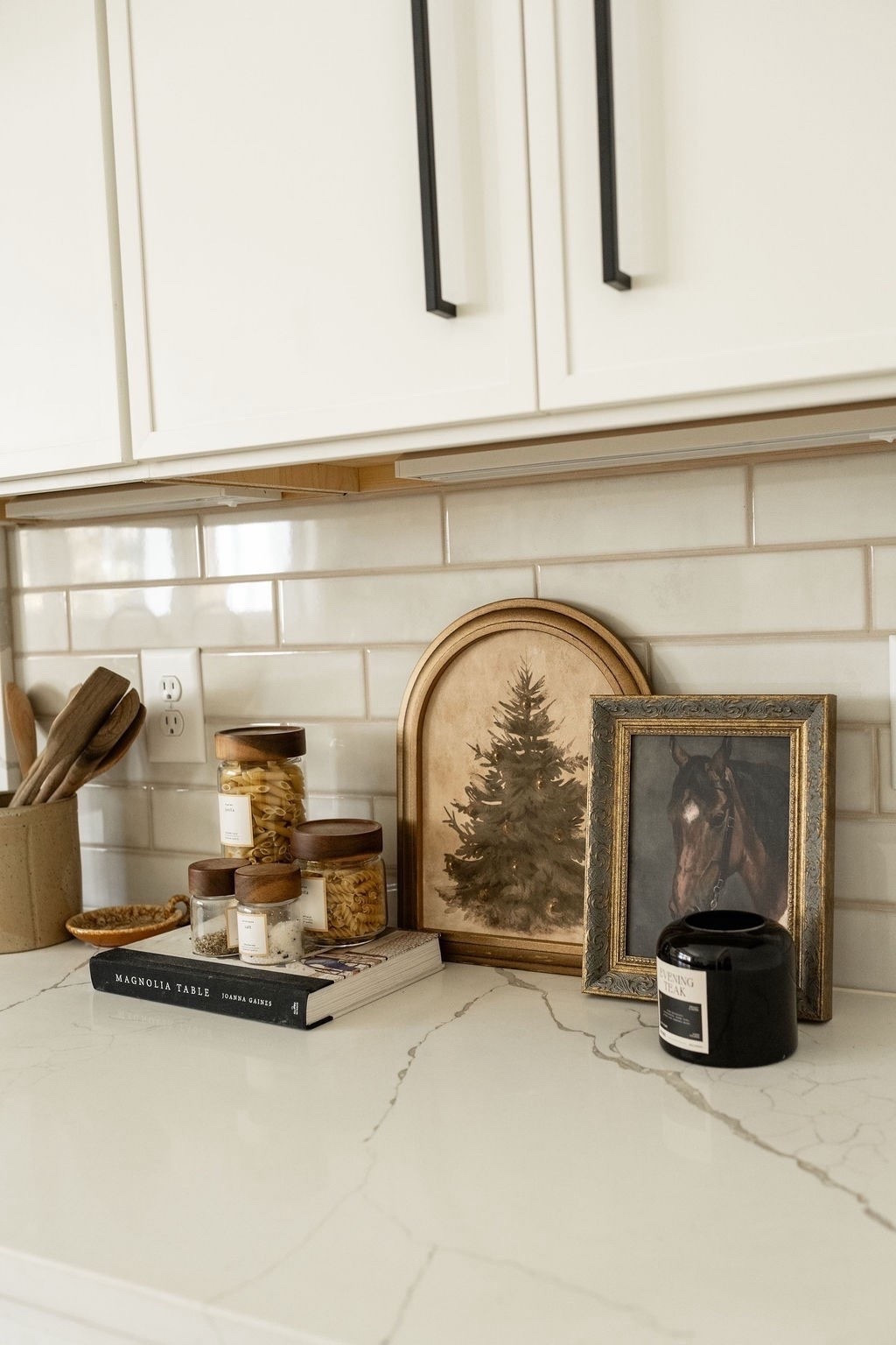 A soft little Christmas touch in the kitchen 🤍🎄 Loving the gold-framed affordable Target Christmas tree art, wood-topped pantry jars, and the warm holiday Target equestrian art tucked into the backsplash. Perfect inspo for Christmas kitchen decorating, neutral holiday home decor, winter countertop styling, LTK Christmas finds, and modern classic holiday accents.

#christmaskitchen #christmaskitchendecor #kitchendecorideas #neutralchristmasdecor #holidaykitchendecor #modernclassichome #neutralholidaydecor #holidayhomedecor #winterhomedecor #targetfinds #targetholidaydecor #targetchristmasdecor #christmasdecorideas #holidaycountertopdecor #kitchenstylingideas #christmasstyling #kitcheninspo #holidayinspo #ltkhomefinds #ltkholidayhomes #ltkwinterstyle #ltkchristmasfinds #cozychristmasdecor #homedecortrends #holidayaesthetic

Do you want to bring our dreamy Modern Classic style interior design into your own home? 🏡 You’re in luck! Reserve our Online Interior Design packages today -> https://porcheandco.com/edesign ✨ We can’t wait to work with you & design your home with #porcheandco


#LTKHome #LTKSeasonal #LTKHoliday