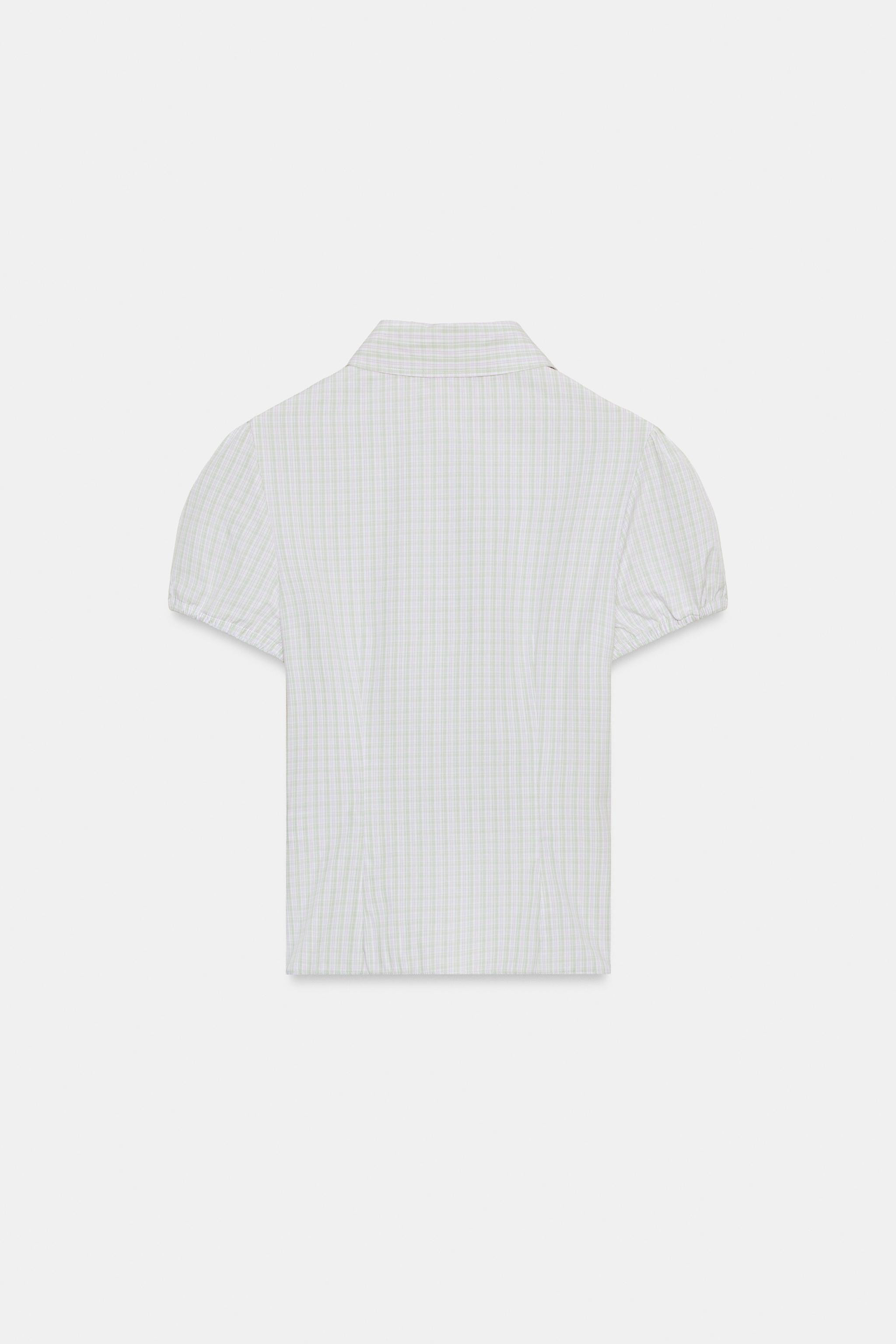 Model height: 180 cmCollared shirt with short puff sleeves. Featuring elasticated shirring on the... | Zara DE