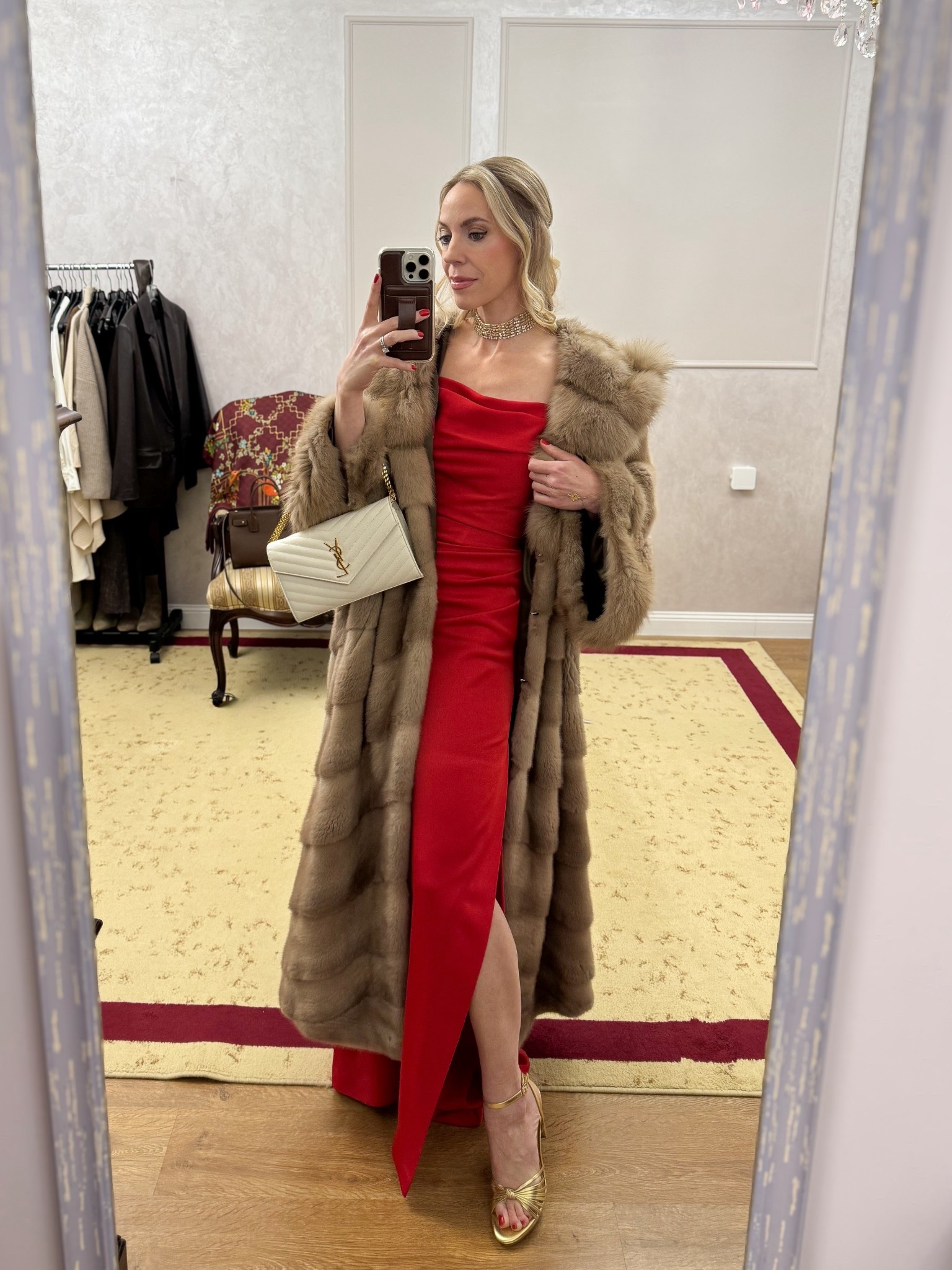 Evening wear, long fur coat, red dress, holiday look, formal wear, gold sandals, off the shoulder gown, gold rhinestone choker necklace, YSL chain wallet clutch 

#LTKParties #LTKShoeCrush #LTKHoliday