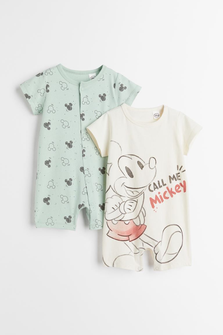 Short-sleeved jumpsuits in soft cotton jersey with a printed design. Short legs and snap fastener... | H&M (US + CA)