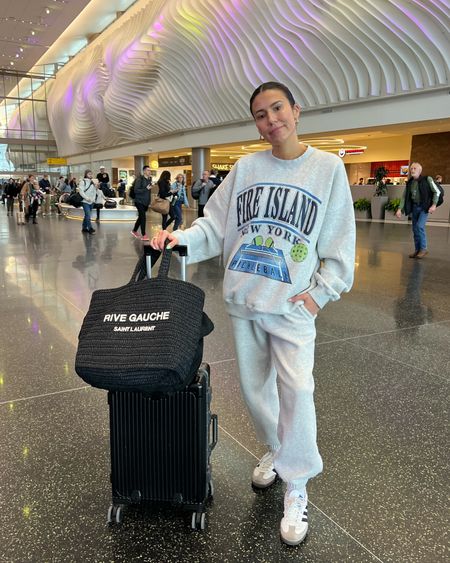 Comfy travel day airplane outfit ✈️ my sweatpants and sweatshirt are SO soft and cozy - they were perfect for travel! 
I’m wearing size L in the sweatshirt. 

Travel outfit; airplane outfit; graphic sweatshirt; gray sweatpants; Abercrombie; amazon; Saks; adidas samba; mom outfit; winter outfit; Christine Andrew 

#LTKshoecrush #LTKSeasonal #LTKtravel