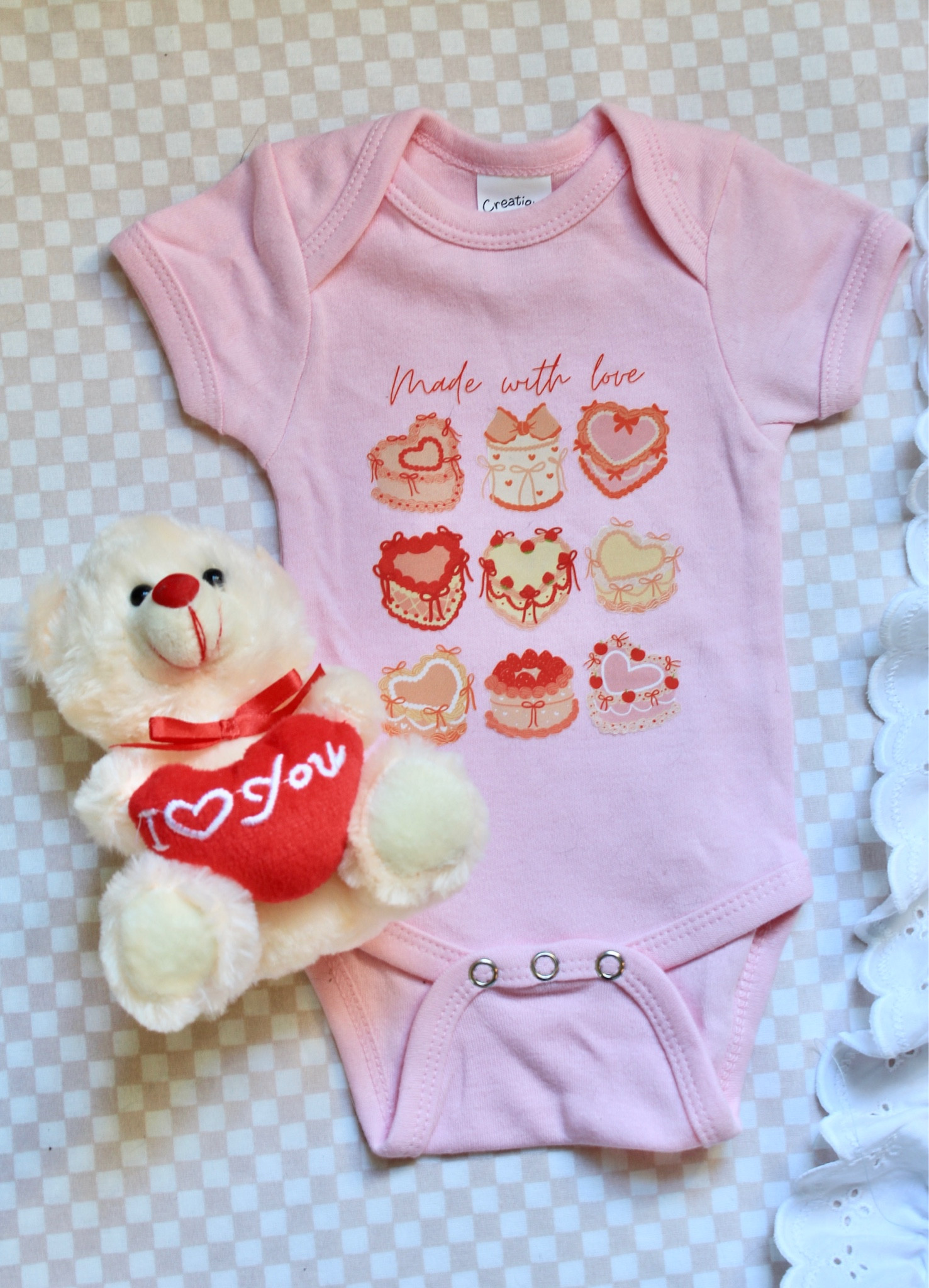 **Sweet Pink Coquette Cake Onesie – Newborn Size**

This adorable newborn onesie is perfect for celebrating Baby’s first Valentine’s Day or any occasion that calls for a little extra sweetness! Made from soft, breathable fabric, it features a charming coquette style with a playful cake print in a soft pink hue. The snug fit and comfortable design ensure your little one stays cozy all day long. Whether it’s a Valentine’s gift or a special treat for your baby, this onesie is sure to make hearts melt!

- **Color**: Soft pink  
- **Design**: Cute cake print, coquette-inspired style  
- **Size**: Newborn  
- **Material**: Soft, breathable cotton blend  
- **Perfect for**: Baby's first Valentine’s Day, baby showers, or everyday cuteness  

This onesie is an absolute must-have for any fashion-forward little one!


#LTKSeasonal #LTKFindsUnder100 #LTKKids