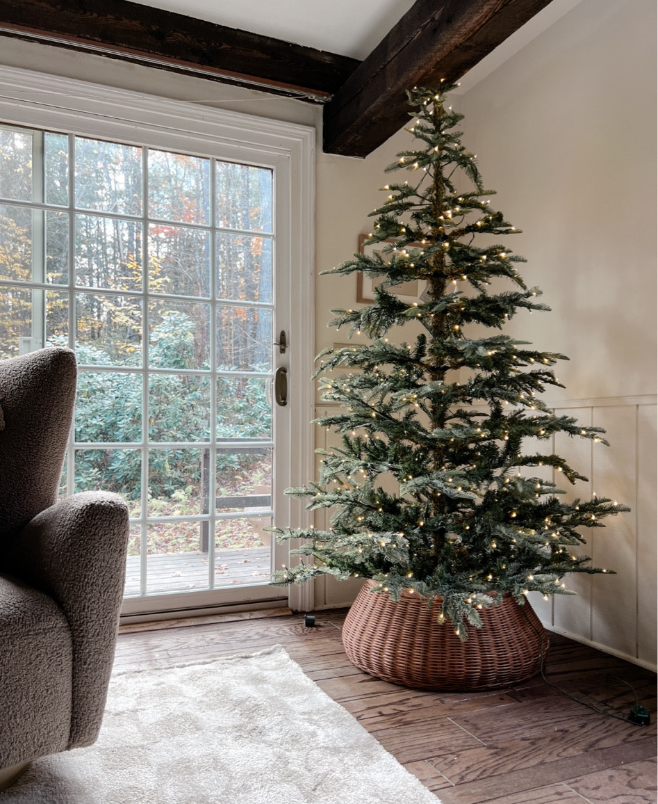 This years Christmas tree! I’m loving the sparse look for the cabin and the woven tree collar is perfection! This tree could not have been easier to assemble and it’s pre-lit. It comes with a remote control and a bunch of different lighting settings and even a storage bag! 

#LTKSeasonal #LTKsalealert #LTKHoliday