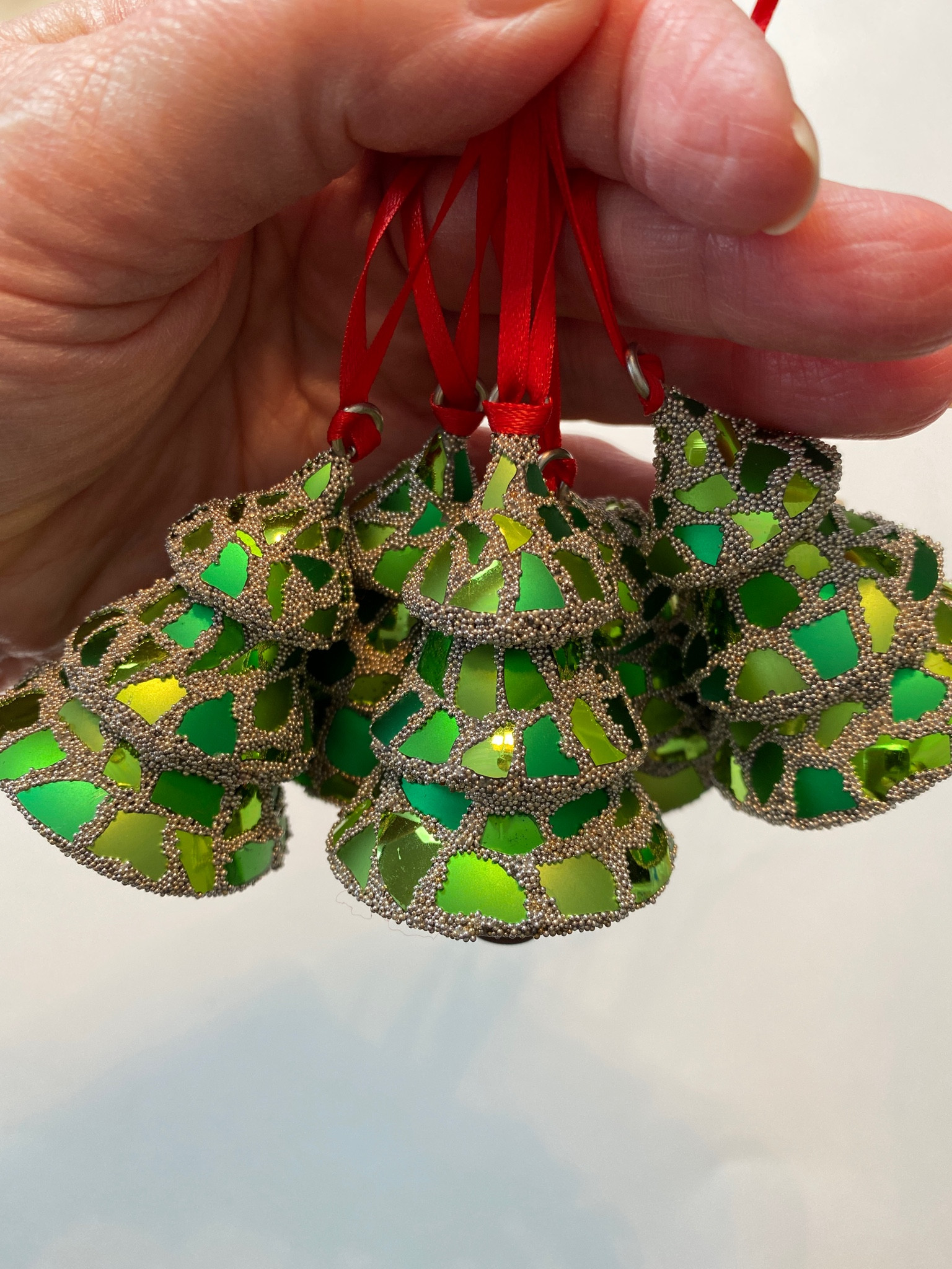 Mosaic Christmas tree ornaments made from broken glass ornaments.🎄

They’re available in 3 different ‘grout’ color ways: metallic silver, pearl, and clear.

For mosaic tips, tutorials, inspiration, and so much more please visit my YouTube channel: YouTube.com/julieweilbacher. 

Follow @julieweilbacher on Instagram for all things mosaic art including: beginner mosaic art - mosaics diy - hostess gift - co worker gift - tree decorating - holiday decor - handmade holidays - Christmas tree ornament - cozy season

#LTKfindsunder50 #LTKHoliday #LTKhome