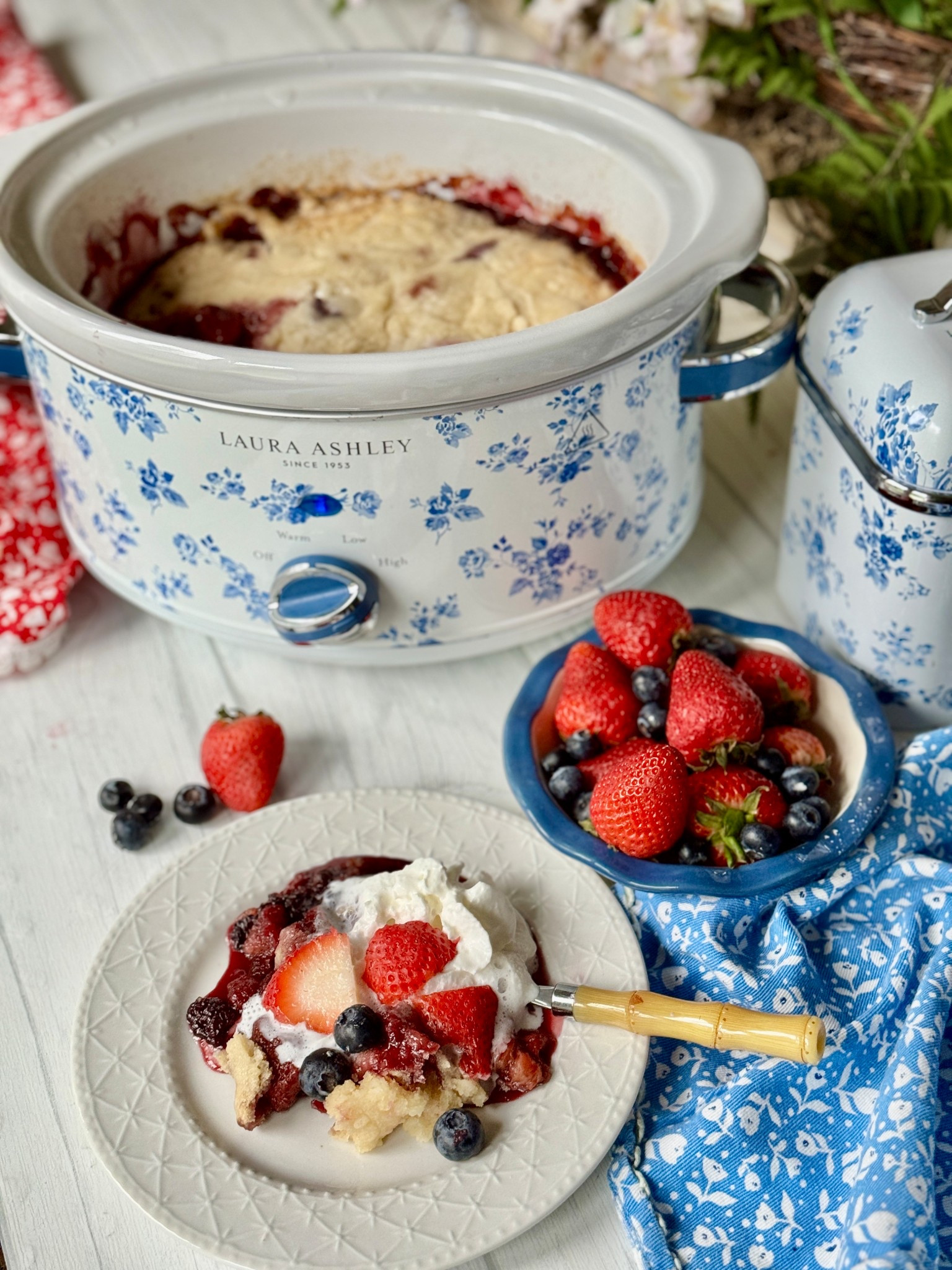 Easy Red, White & Blue Slow Cooker Berry Cobbler
Looking for a simple and sweet Memorial Day dessert? This easy berry cobbler is made right in the slow cooker with frozen berries, cake mix, and a few hours of hands-off magic.

Topped with whipped cream and fresh berries, it’s the coziest way to serve up that red, white, and blue—without ever turning on the oven.

A perfect dessert to enjoy and share as we gather this weekend—and take a moment to remember and honor the heroes who gave everything for our freedom.

Styled with my favorite floral slow cooker from @lauraashleyusa and @myvqus—because summer desserts should be as charming as they are easy.