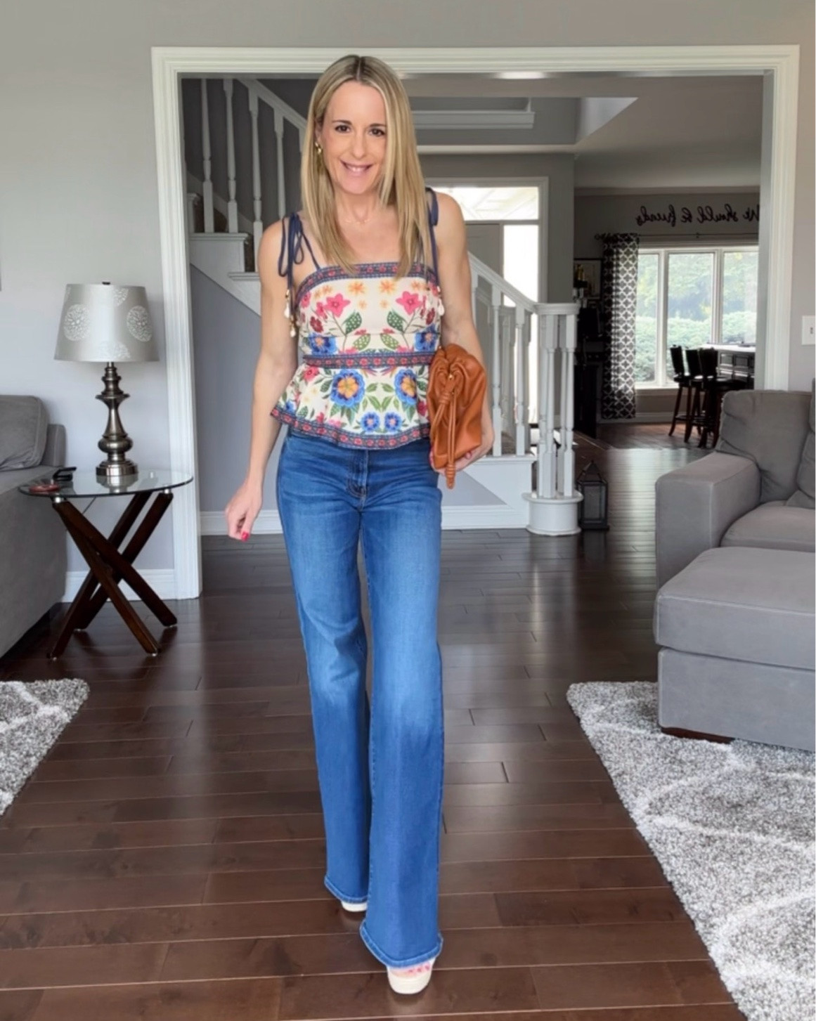 I wore this top out over the weekend for drinks with friends and got so many compliments!  The silhouette is super flattering and I love the peplum detail. It looks great with jeans but would also look cute paired with shorts this summer!

Spring outfit // spring style // peplum top // floral peplum top // summer style // summer outfit // Amazon top // tie shoulder peplum top // sleeveless peplum top

#LTKootd #LTKOver40 #LTKPetite