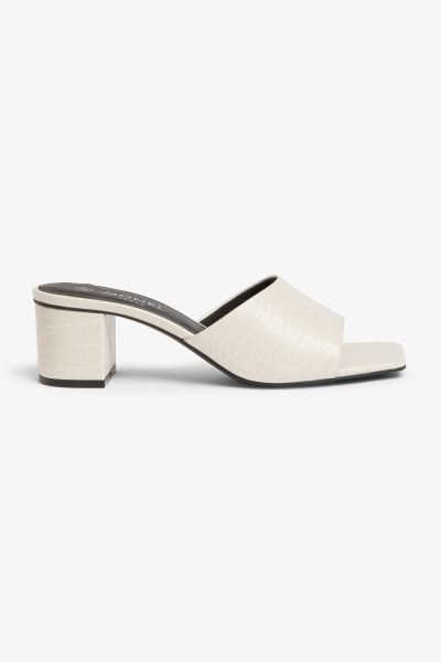 Mules mit Absatz, quadratischer Spitze und Futter aus Lederimitat. Mit weich gefütterter Zehenpa... | H&M (DE, AT, CH, NL, FI)