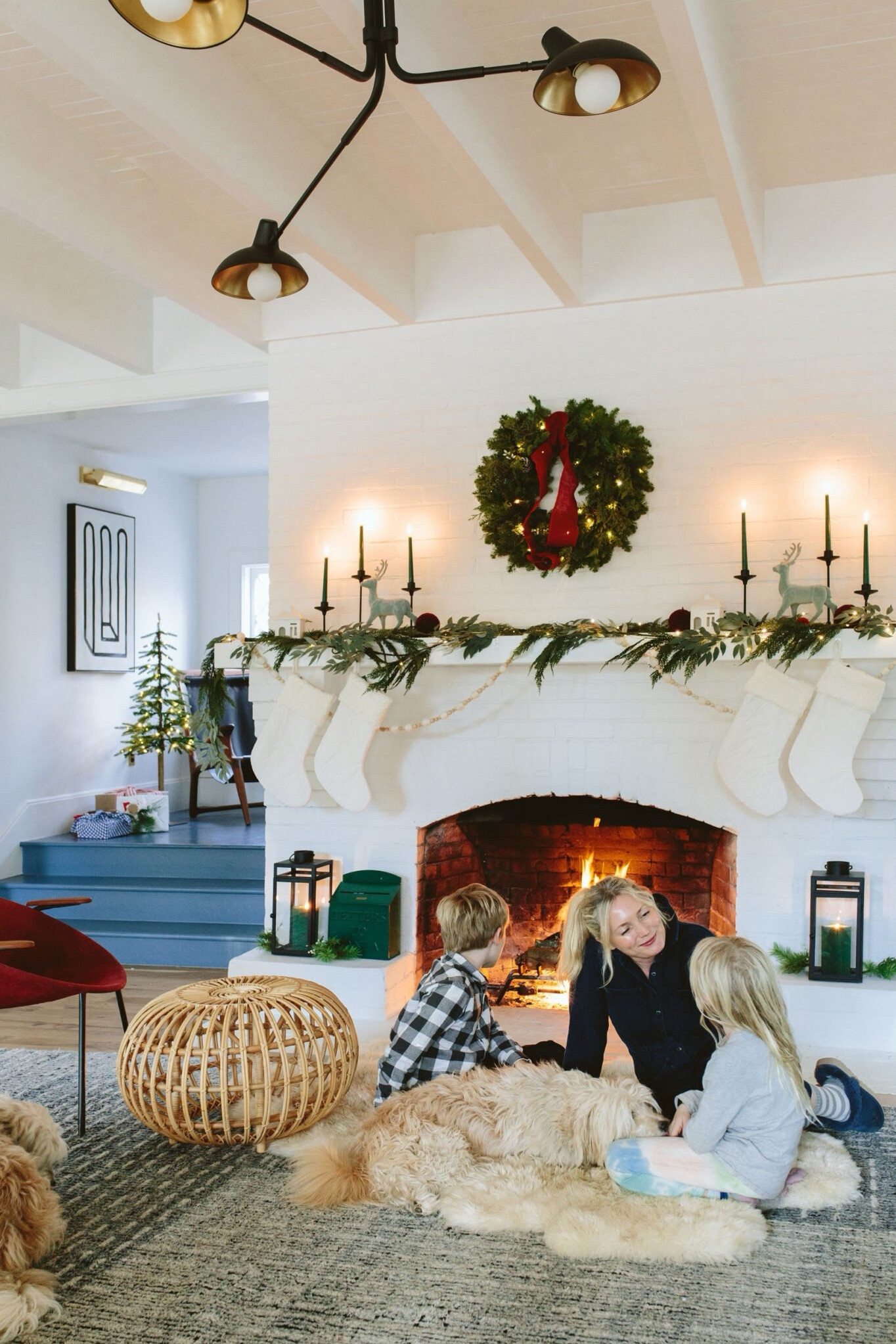 This was our easy holiday mantel from last year. The wreath was real (look at me!) and I kinda wanted to replace the garland with a real one, but not enough to actually do it. We’ve had the green Santa box for years and the kids drop letters in it frequently (I think it’s probably the last year and we totally forgot to do Elf on the Shelf which they are asking for so I need to run out and find that dude). ANYWAY - if you’re in the market for an affordable Christmas vignette, these are a few of my favorite pieces: simple wooden garland, a bit of greenery, some nice candles, a row of stockings, and a little bit of whimsy (the flocked deer come in grey this year - it’s a little more grown up than this blue version, but I love both!). 

#LTKfamily #LTKGiftGuide #LTKHoliday