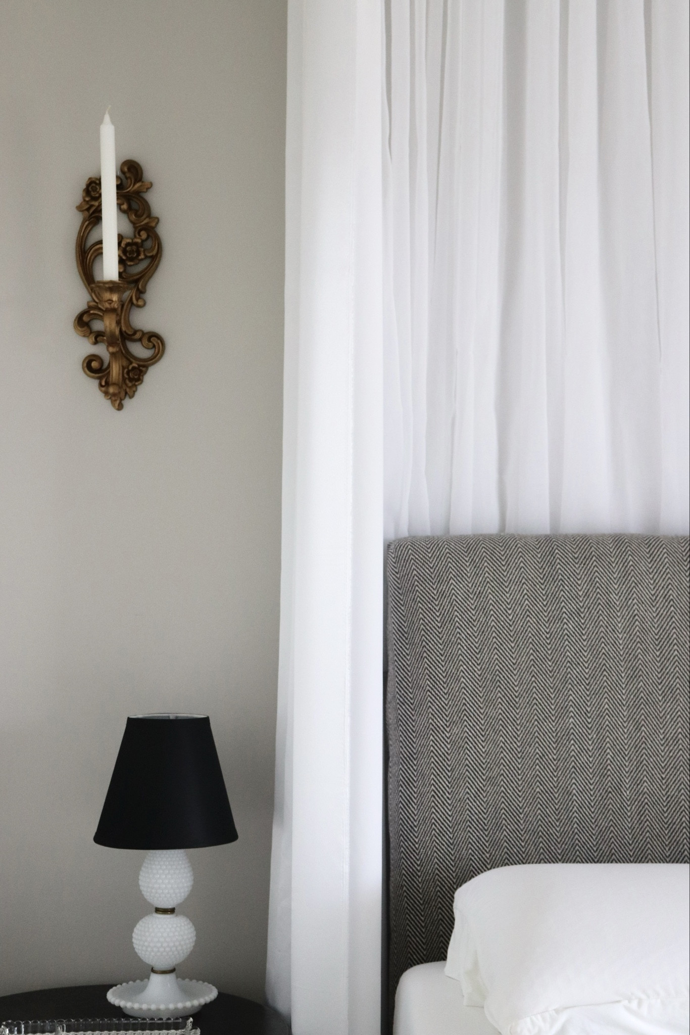 Here are the same ornate gold wall candle sconces in our guest room. I linked tons of similar vintage milk glass lamp bases (+ the exact lampshade I used!).

Vintage home decor. Neutral bedroom. Hotel bedroom. Vintage candle sconces. Vintage lamp.

#LTKfindsunder100 #LTKfindsunder50 #LTKhome