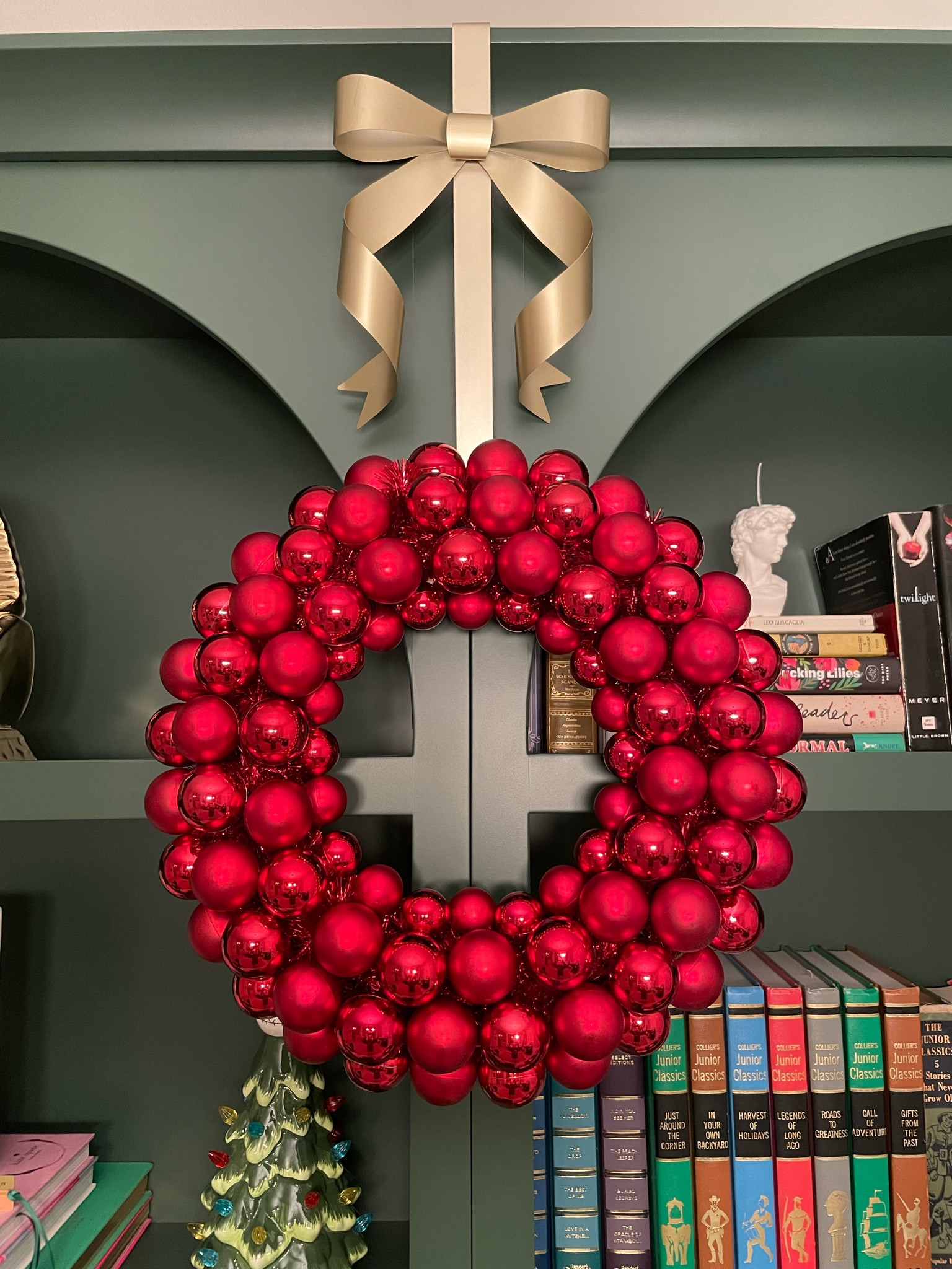 Gold bow wreath holder from Michael’s for under $10. Bow Christmas decor  

#LTKHoliday #LTKHome