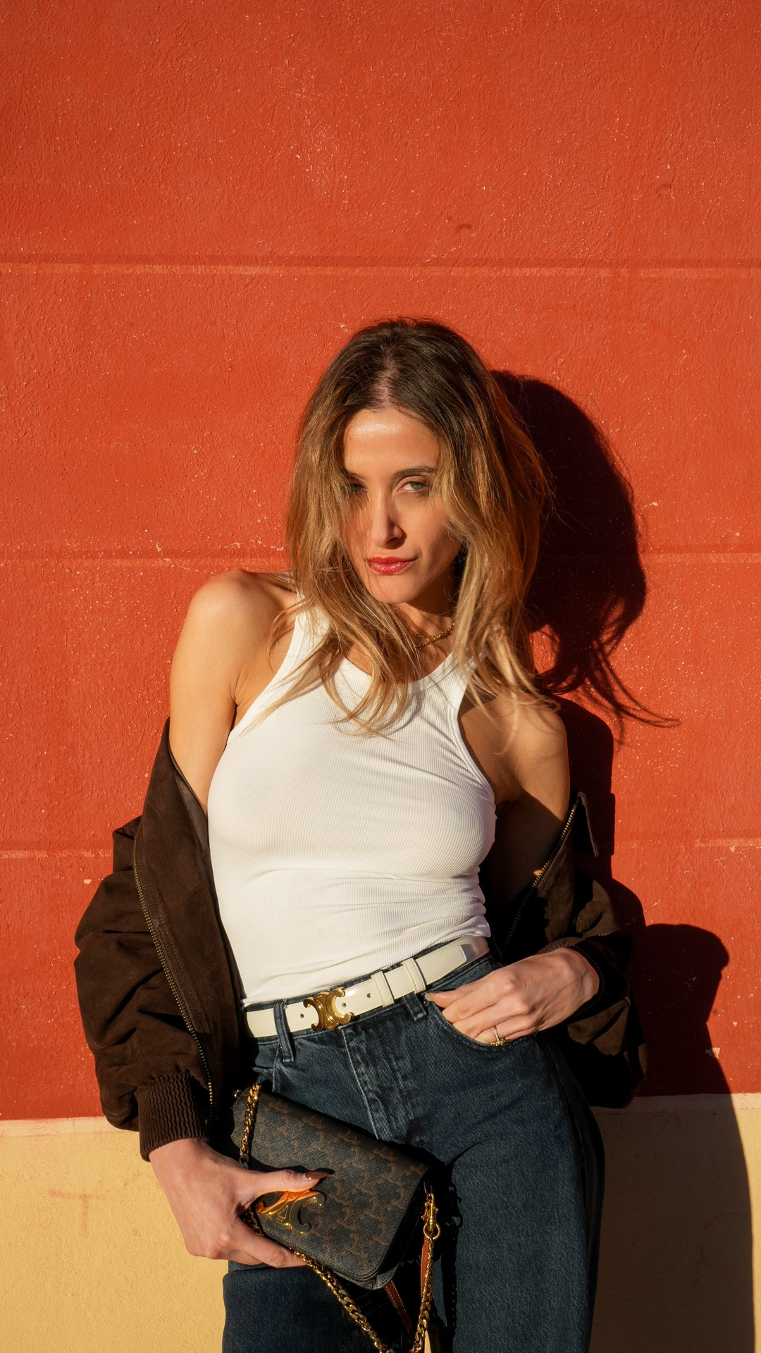 Golden hour off-duty look: white ribbed tank, relaxed dark denim and brown suede jacket, finished with the Celine Triomphe belt + bag. Tap to shop the full outfit.

white ribbed tank, brown suede bomber jacket, relaxed dark blue jeans, Celine Triomphe belt, Celine Triomphe crossbody bag, casual chic outfit, everyday denim look, French Riviera style

#FrenchRivieraStyle #CasualChic #DenimOutfit #WhiteTank #CelineTriomphe

#LTKautumn #LTKbag #LTKstyletip