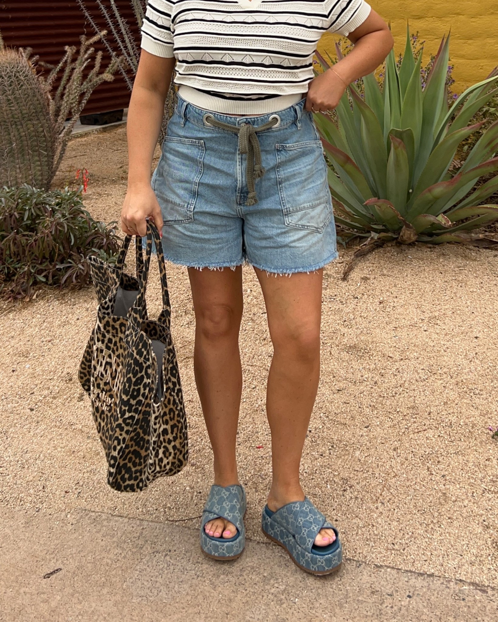 Free people denim shorts tts 30 size down for a more snug fit I love the looser look! Size large in this knit top it’s so cute. Gucci clogs are from last year but linked similar color style! Bag is huge fits so much 